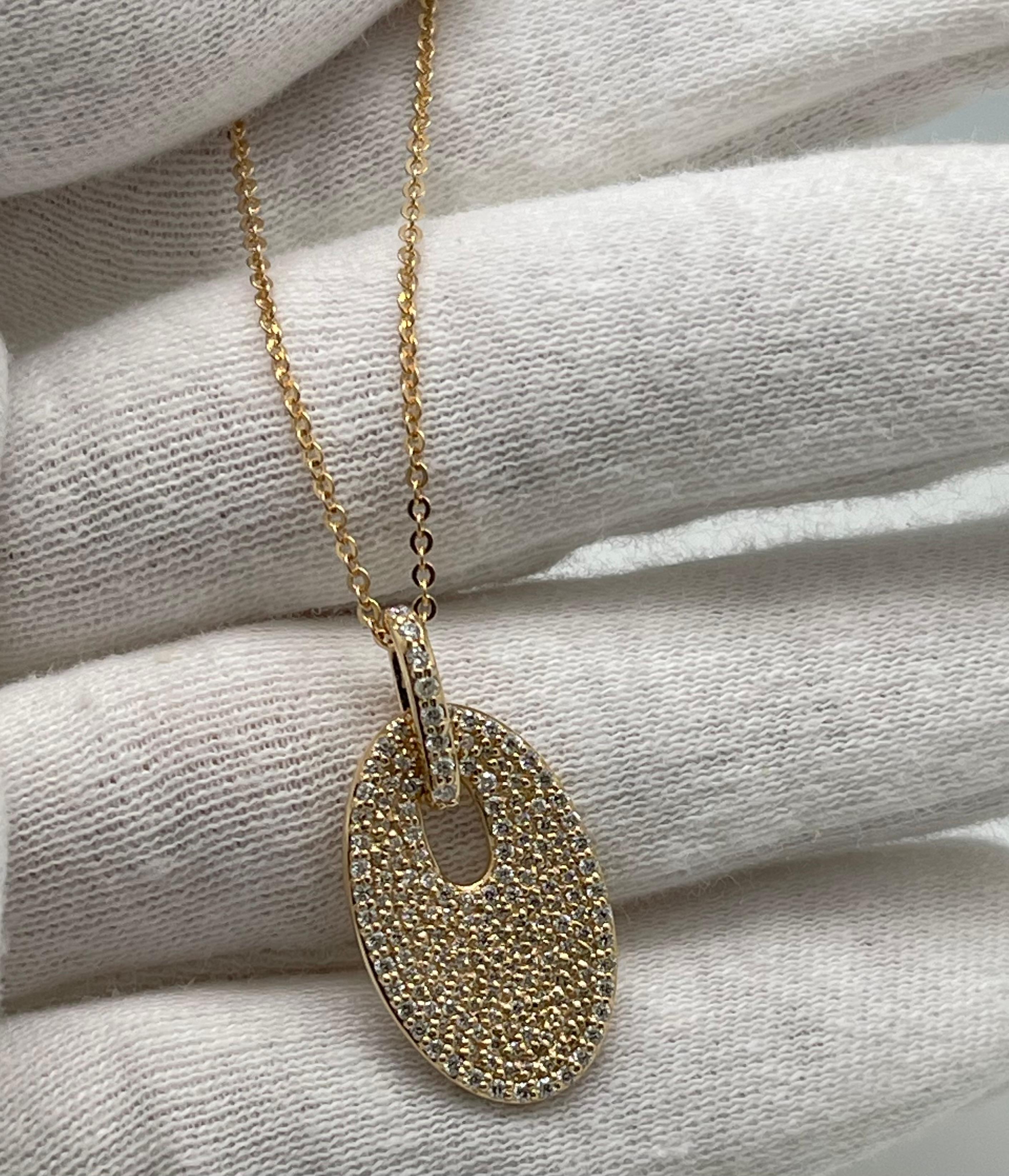 Modern Diamond Pave Oval Disc Pendant in 14 karat Yellow Gold With .60 Carat For Sale 1
