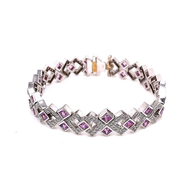A unique bracelet featuring 7.78 carats of square shaped pink sapphire. They are complemented by 2.39 carats of VS quality round brilliant cut diamonds. All set in 18k white gold, this fun bracelet can be dressed up or down depending on the