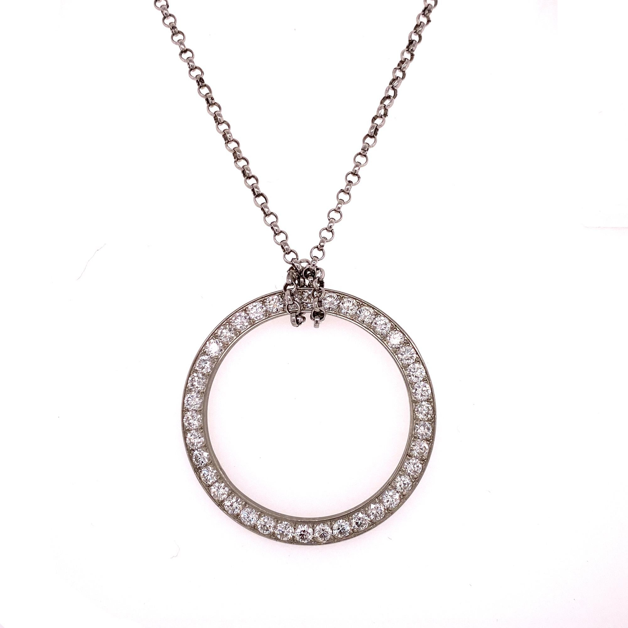 Fabulous large diamond open circle of life pendant crafted in platinum. The 1.5 inch circle features 38 round brilliant cut diamonds weighing 3.80 carat total weight and graded G-H color and VS clarity. The platinum chain measures 18 inches in