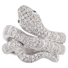 Anello moderno a serpente con diamante e rubino in oro bianco 18 carati