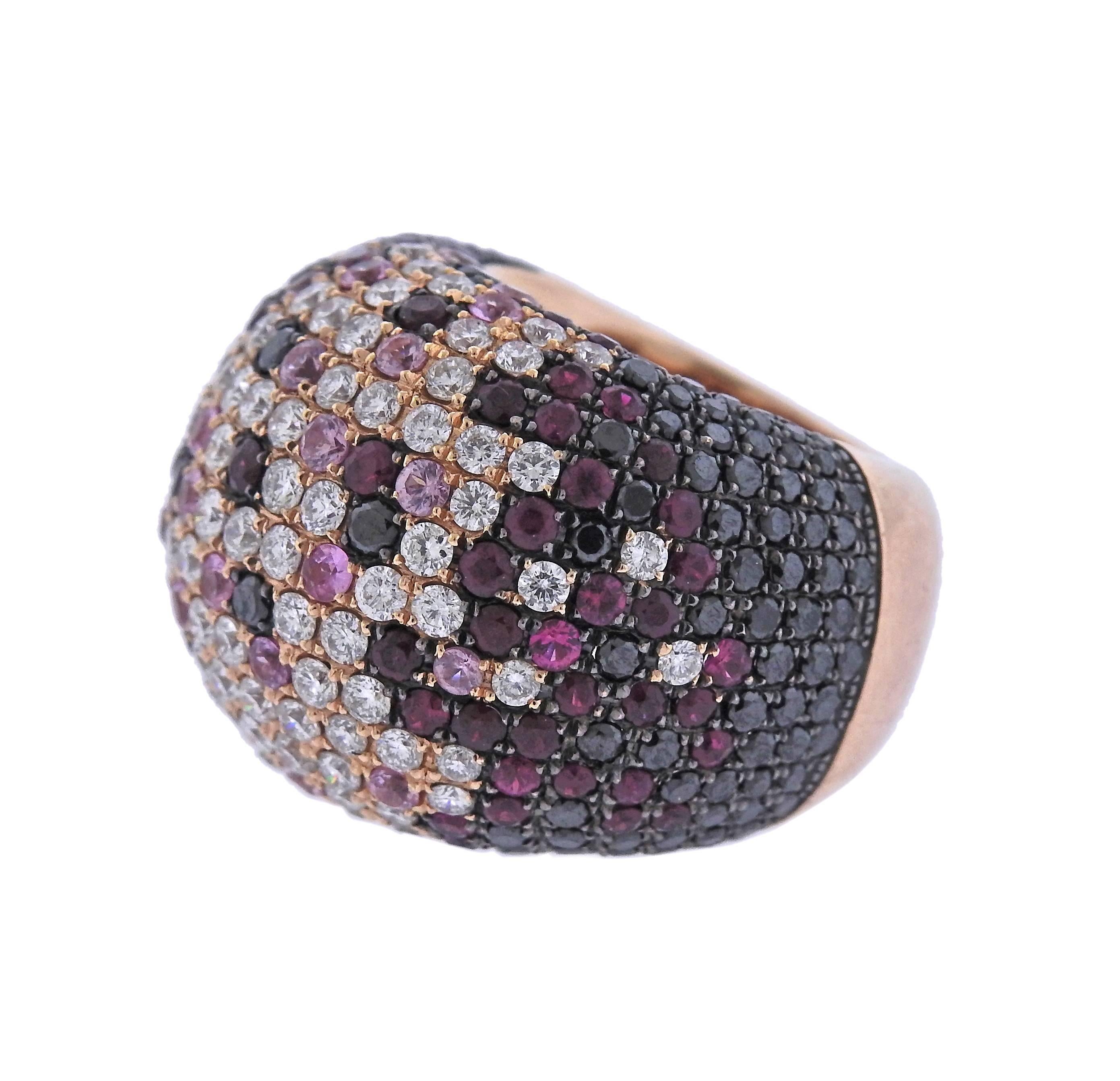 Modern large 18k rose gold ring, crafted with approx. 3.00ctw in white and black diamonds, pink sapphires and rubies.  Ring size 6, ring top is 21mm wide and weighs 21.7 grams. Marked: 750, LTJ. 