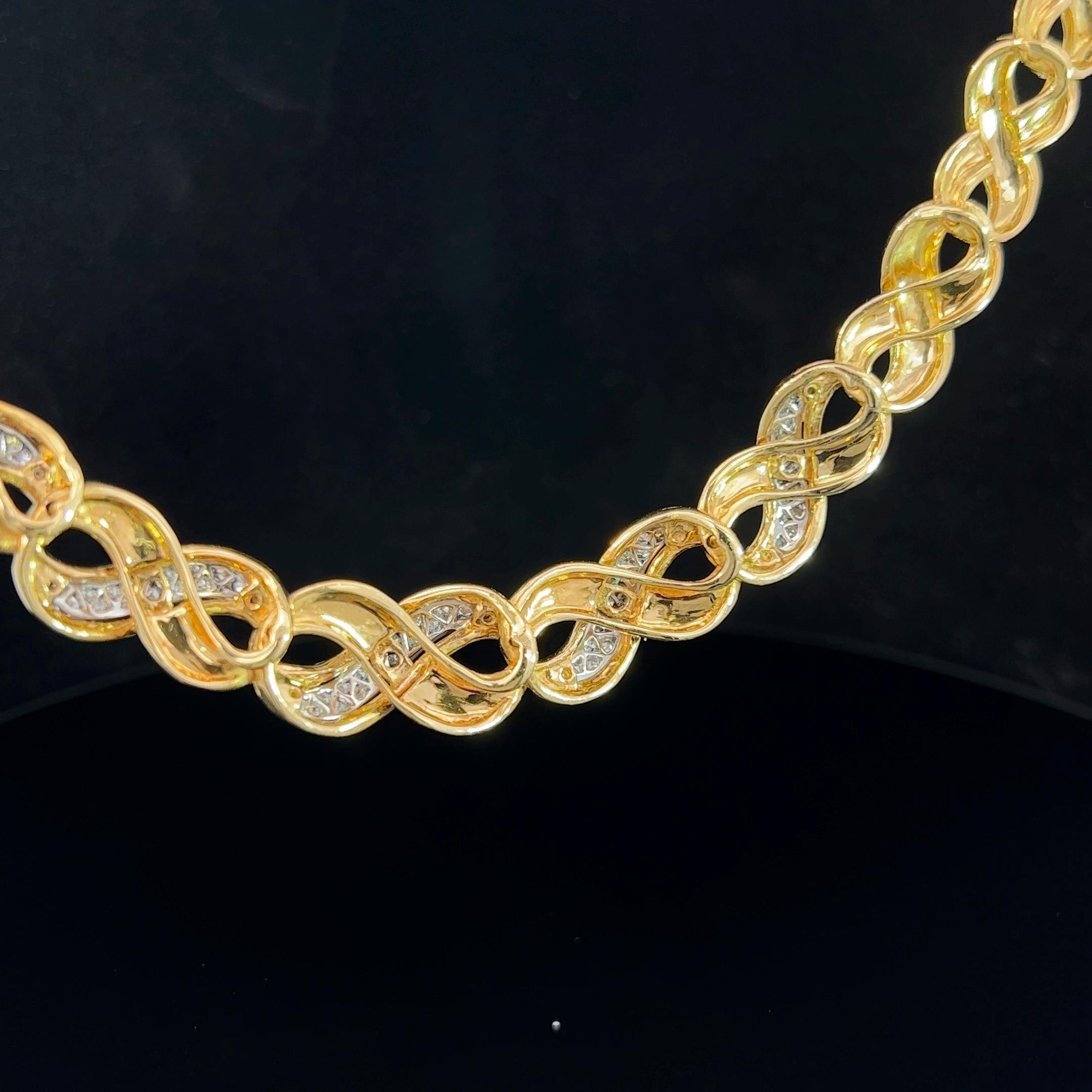 Statement collar crafted in 18k yellow gold and pave set with diamonds. This necklet consists of a tapered series of figure eight, the infinity symbol gold links. The links measure 9.6mm to 12.8mm wide. This necklet is possibly Italian made with