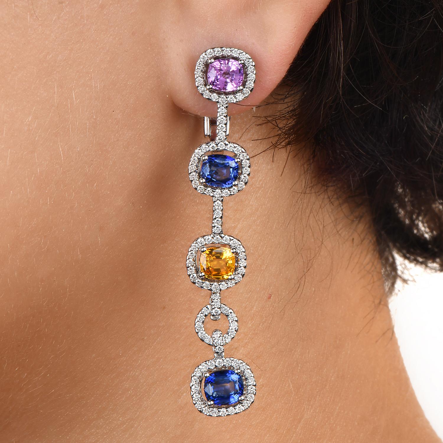 These Colorful Halo Diamond, Blue, yellow, and Pink Sapphires made in 18K Gold Link Dangle Earrings, are a stunning combination of vibrant gemstones and exquisite craftsmanship.

These earrings are a true reflection of contemporary elegance and