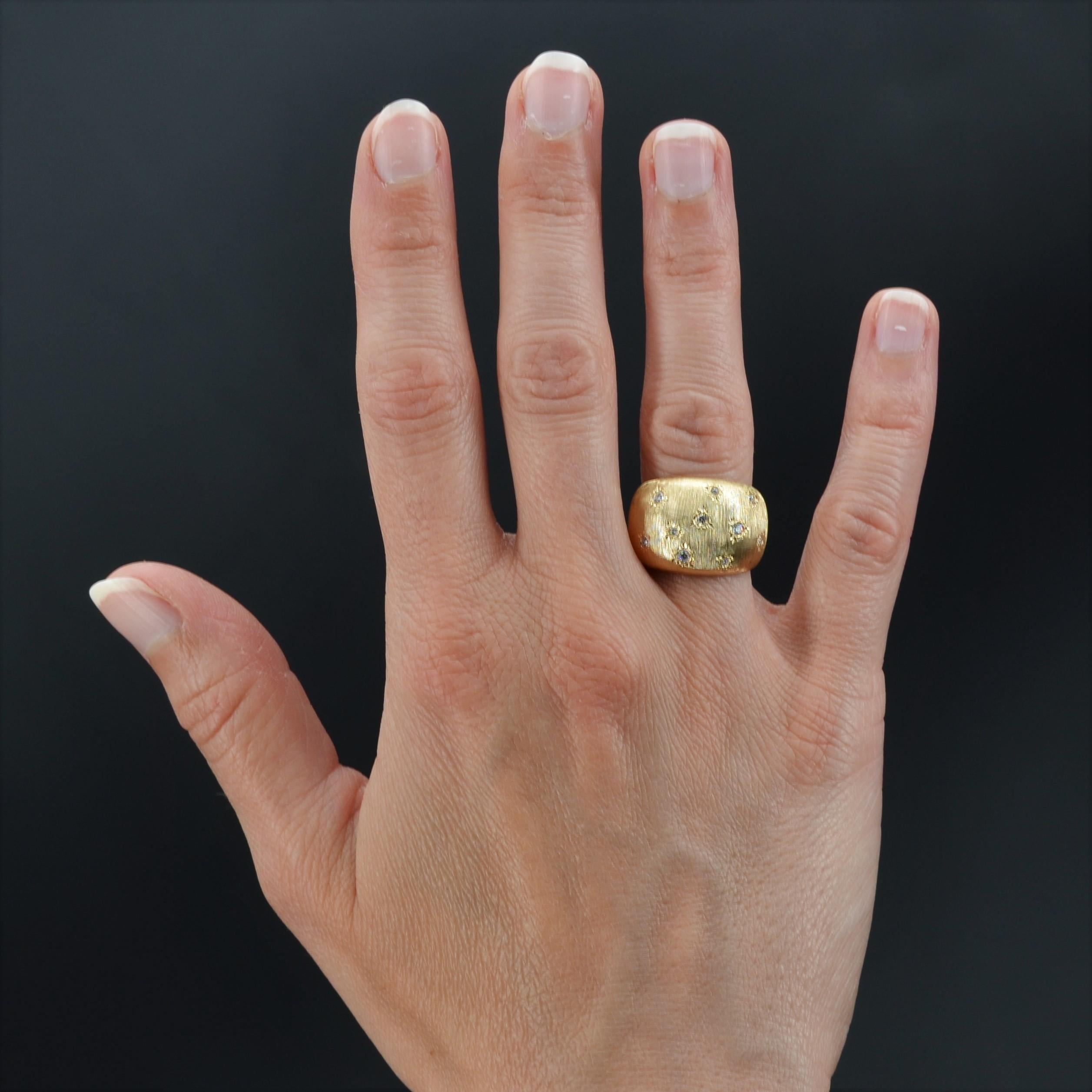 Ring in 18 karat yellow gold, own hallmark.
Yellow gold bangle ring, it is chiselled such of the satin on all the setting and decorated on the top of 10 diamonds modern brilliant- cut in star settings.
Total weight of diamonds : 0,18 carat