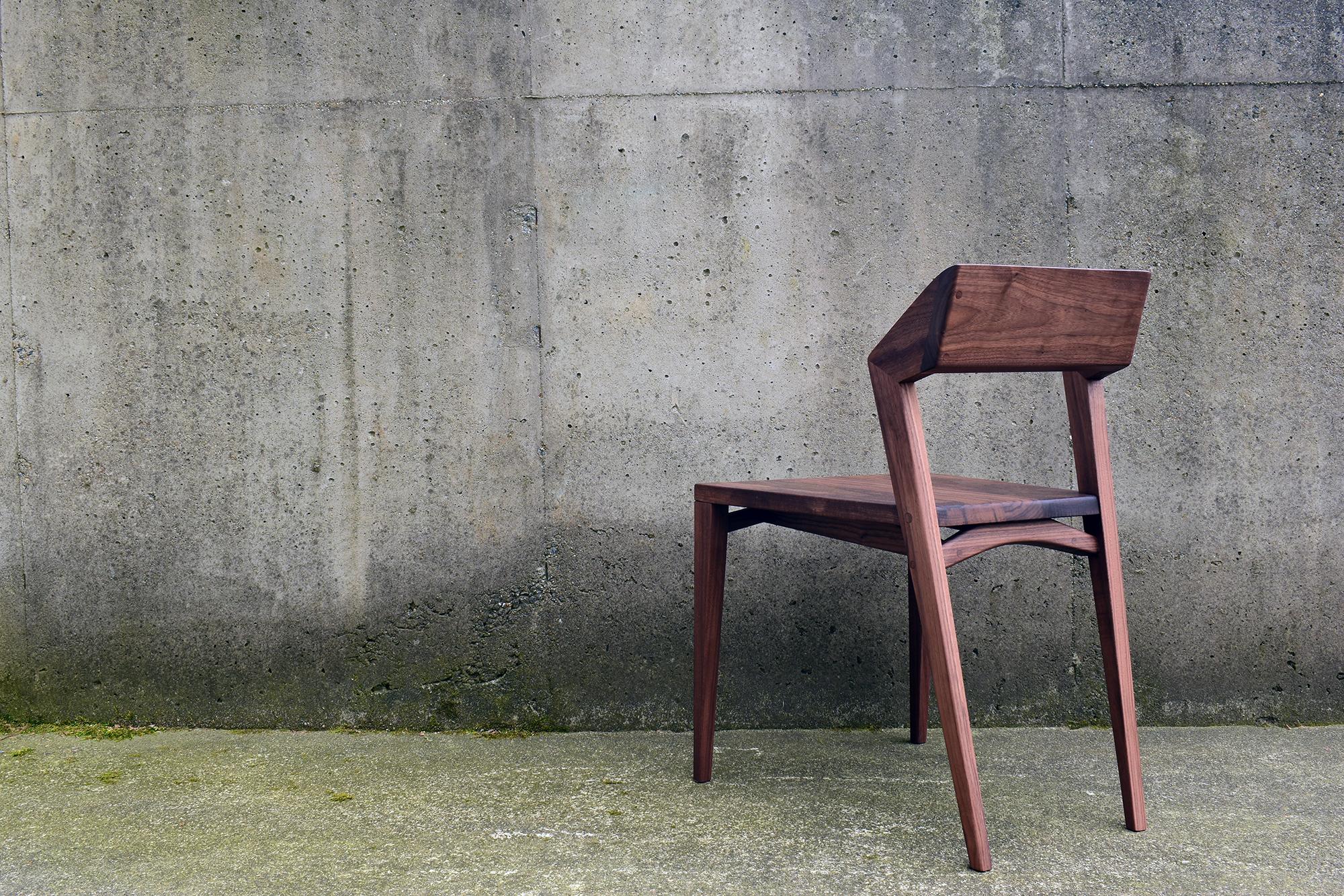 This modern dining chair with crisp, minimal lines is designed to work with modern/contemporary/transitional dining areas, as well as rustic/reclaimed farmhouse style tables. The backrest has gently faceted surfaces for a distinctly warm, geometric,