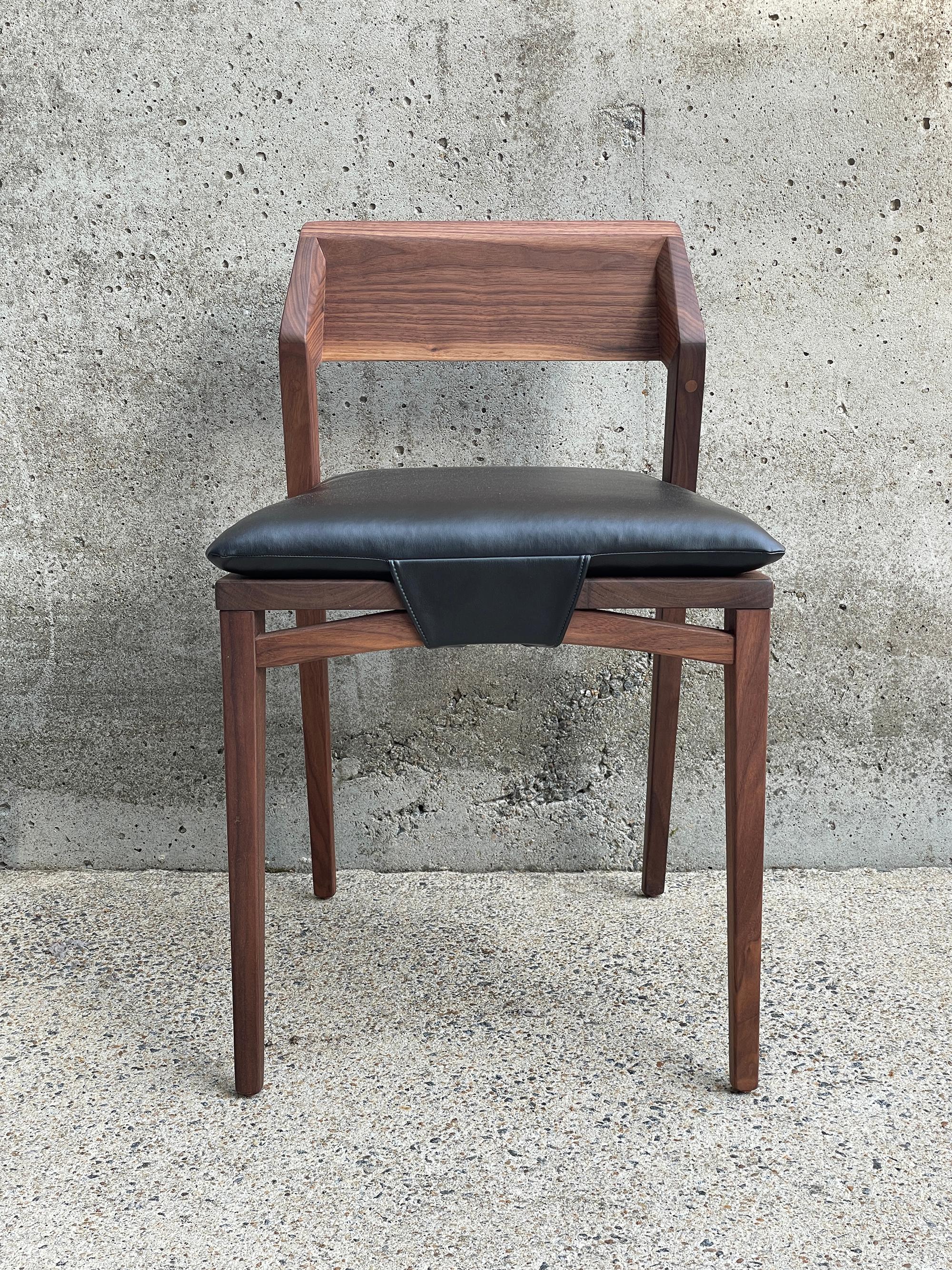 This modern dining chair with crisp, minimal lines is designed to work with modern/contemporary/transitional dining areas, as well as rustic/reclaimed farmhouse style tables. The backrest has gently faceted surfaces for a distinctly warm, geometric,