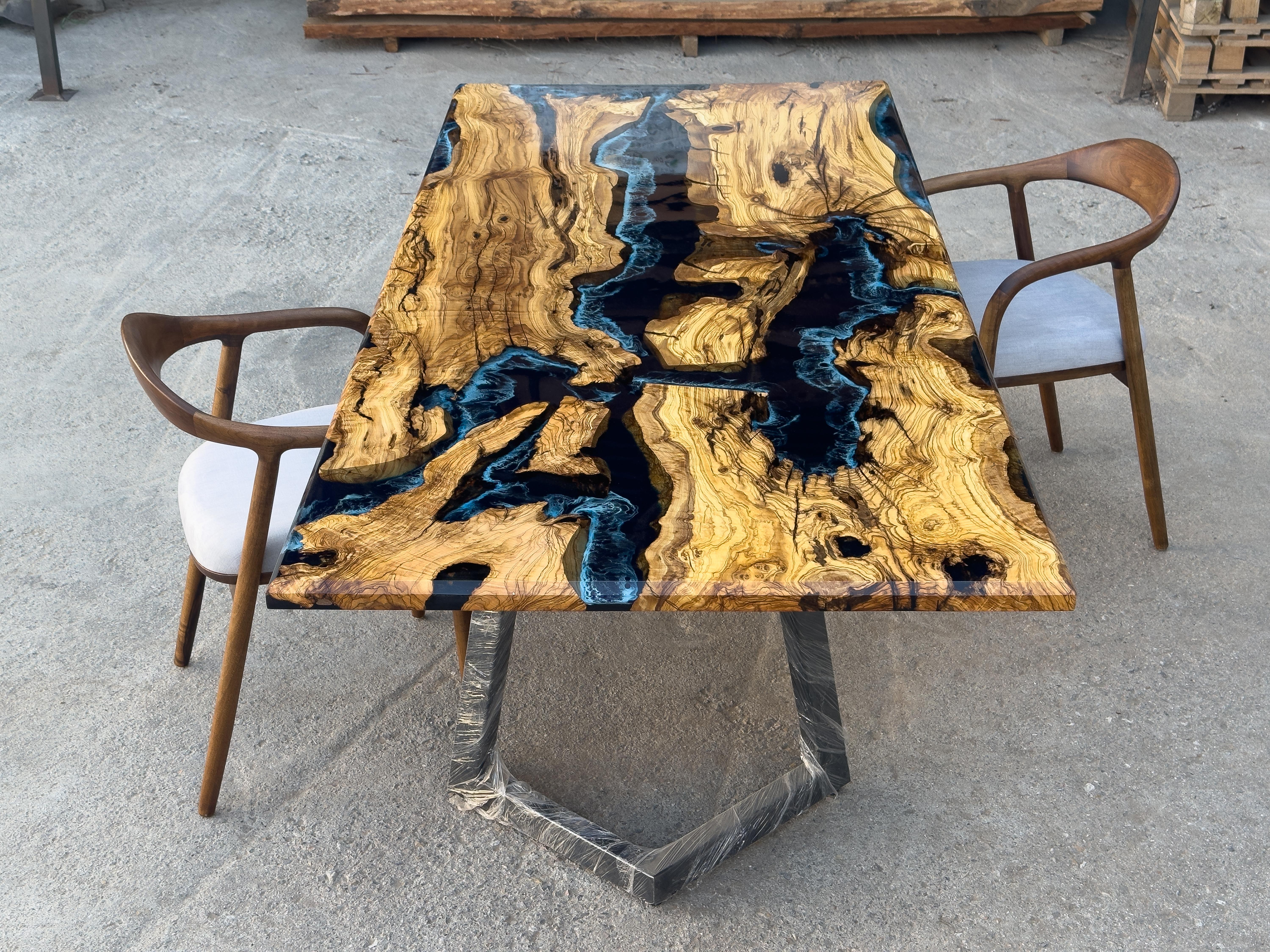 Olive Epoxy Resin Table - Custom Olive Epoxy Table

This stunning table is made of Mediterranean Olive wood. The unique beauty of the natural curves of olive wood combined with blue epoxy is seen in this table.

All woods have its own natural shape.
