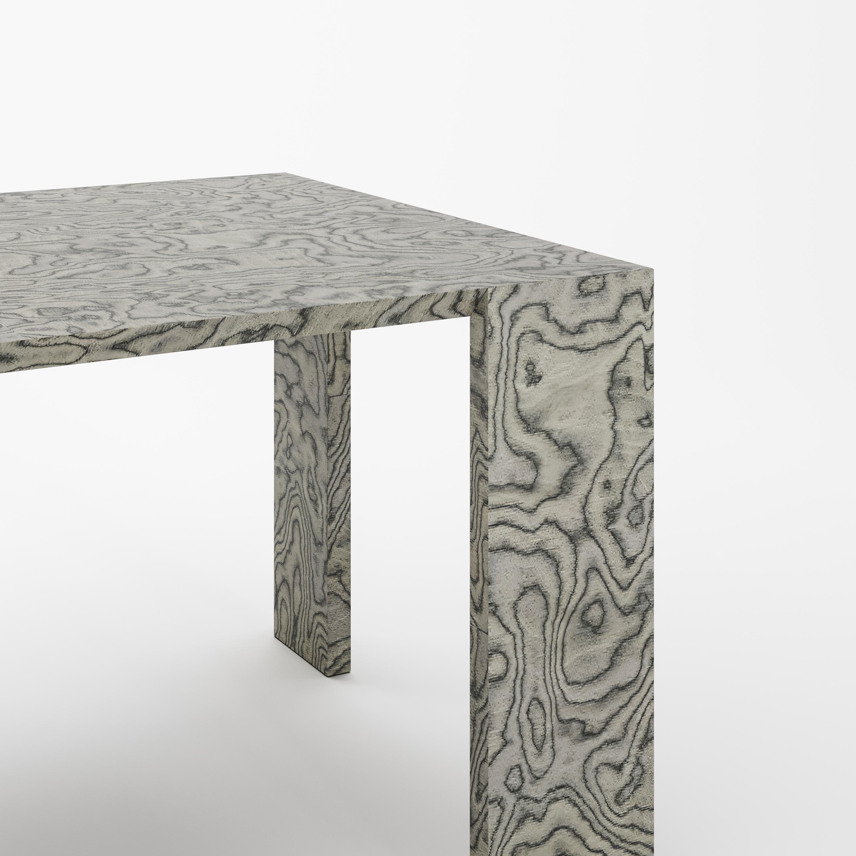 ‘Ispolin’ is a modern dining table in the famous ALPI finish created by Ettore Sottsass. 

This elegant dining table attracts attention with its clean, crisp lines. But in the Sottsass Grey finish, it looks even fresher, as if it were a bridge