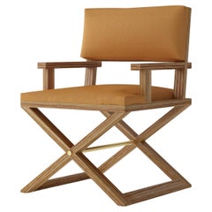 Modern Director-Style armchair with sculptural wood frame and leather upholstery