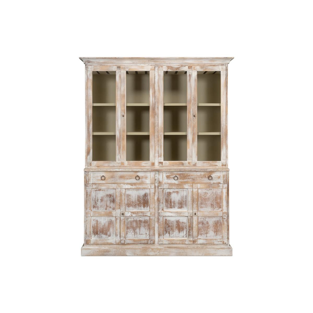 Modern distressed finish hutch, made of solid pine and painted and then hand rubbed to show an antiqued look. The interior was fitted with wine racks, and drawers, with glass front doors, raised on a high wasted four-door lower cabinet with two