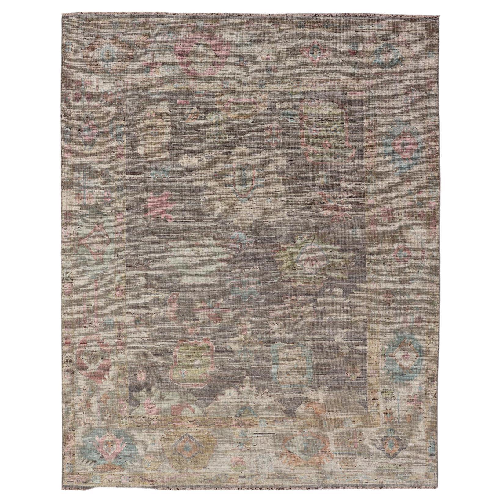 Modern Distressed Oushak in Large Floral Design on Brown Field and Tan Border For Sale