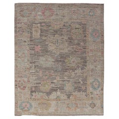 Modern Distressed Oushak in Large Floral Design on Brown Field and Tan Border