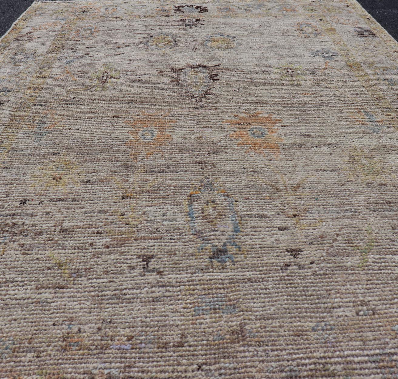 Modern Distressed Oushak With All-Over Floral Design on Cream Field and Border. Keivan Woven Arts/ rug /AFG-65734 Country of Origin: Afghanistan Type: Oushak Design: Floral, All-Over, Arabesque-Floral 21st century. 
Measures: 3'9 x 5'8 
Modern