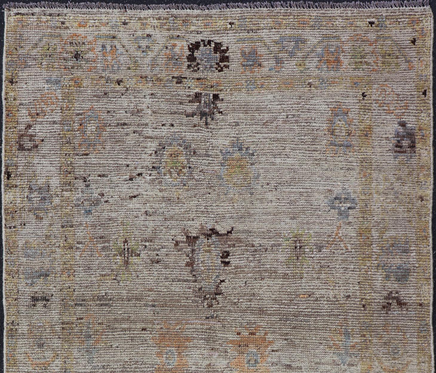 Modern Distressed Oushak With All-Over Floral Design on Cream Field and Border  In New Condition For Sale In Atlanta, GA