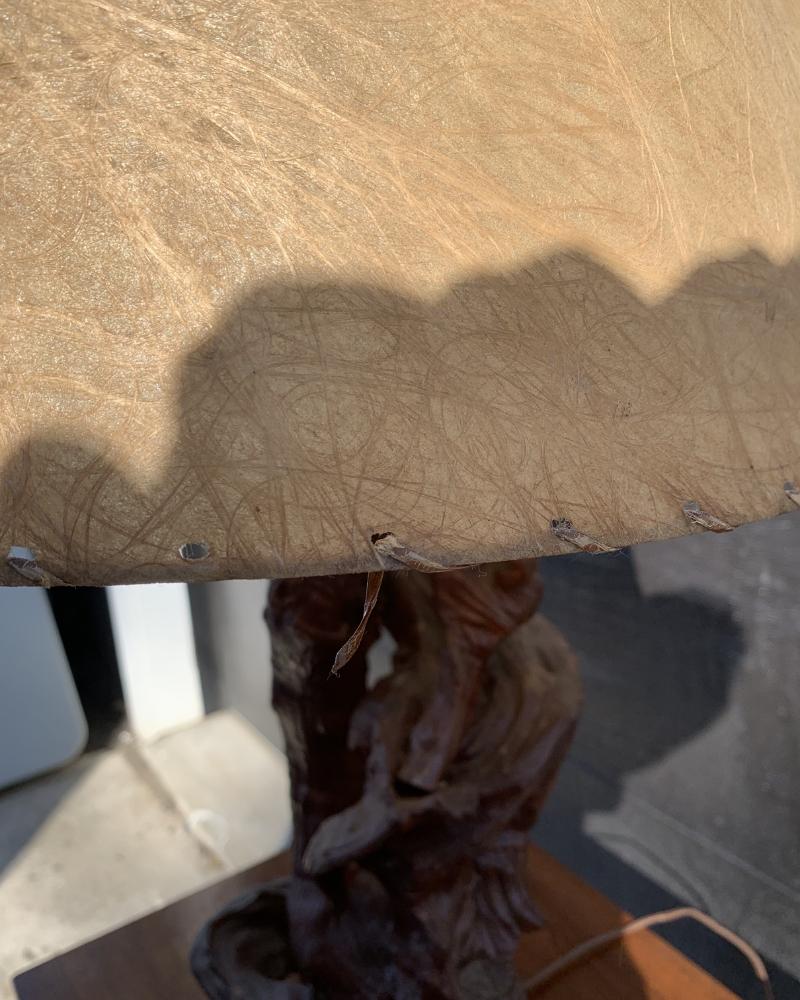 Mid-Century Modern Driftwood Lamp with Fiberglass Shade

Add a touch of organic elegance to your home with this vintage mid-century modern driftwood lamp. This unique piece features a natural driftwood base and a sleek fiberglass shade, creating a