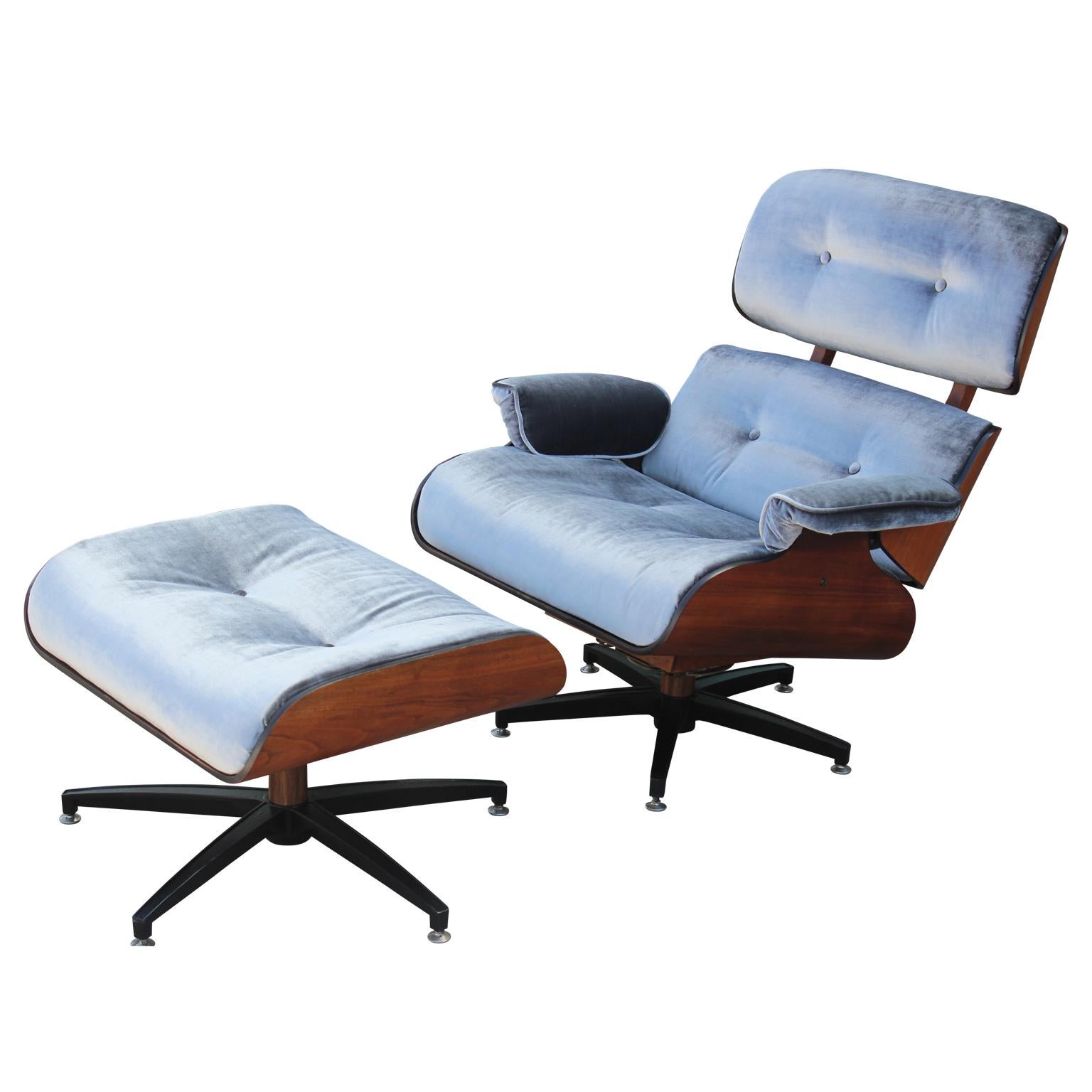 Gorgeous and modern Eames style walnut lounge chair and ottoman freshly upholstered in a lush silver velvet.