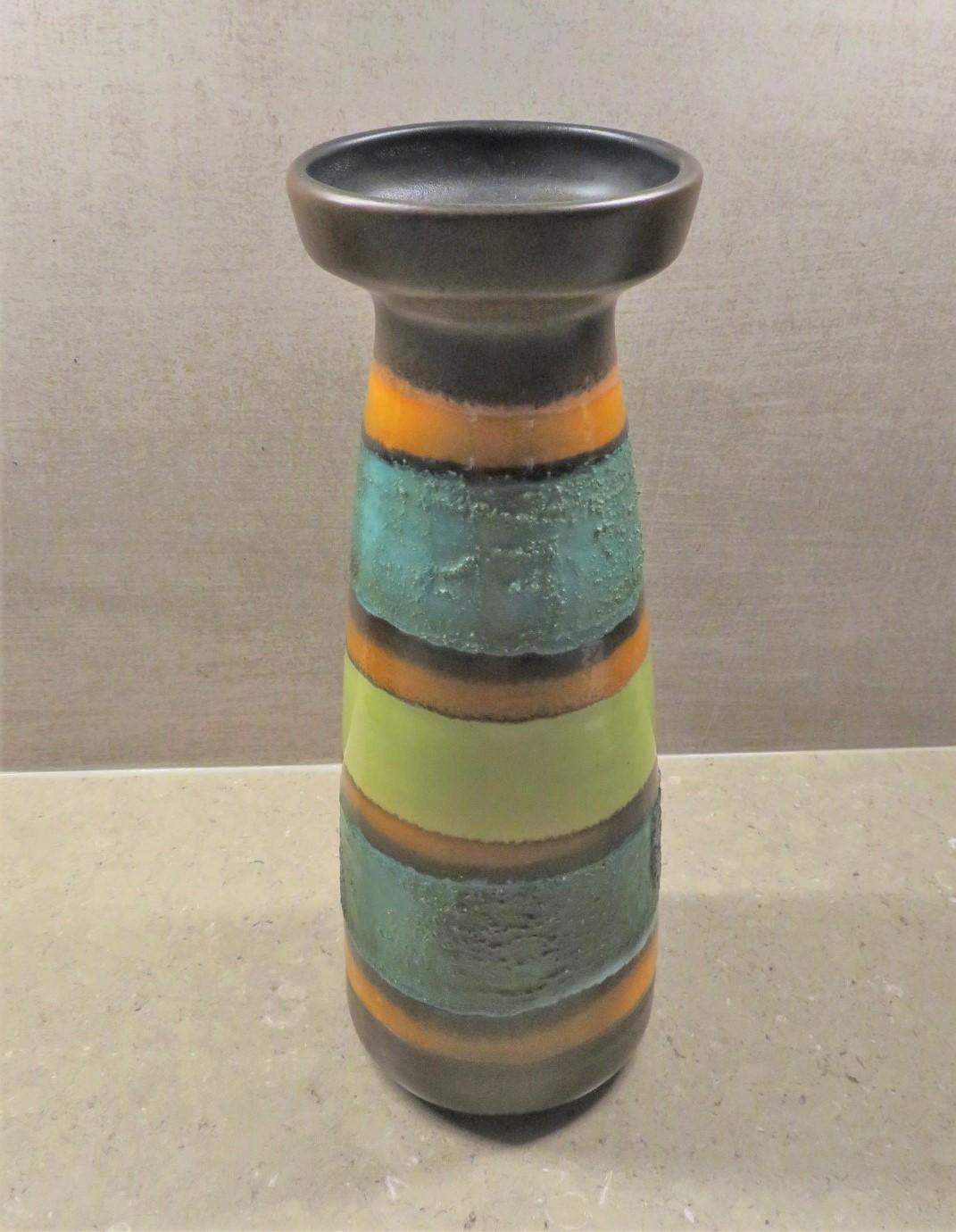 Bright and colorful Mid-Century Modern East German ceramic lava glaze vase from the 1960s and VEB Haldensleben.

VEB Haldensleben was formed from the Carstens Uffrecht factory in 1945. VEB stands for the German “Volkseigener Betrieb”, meaning a
