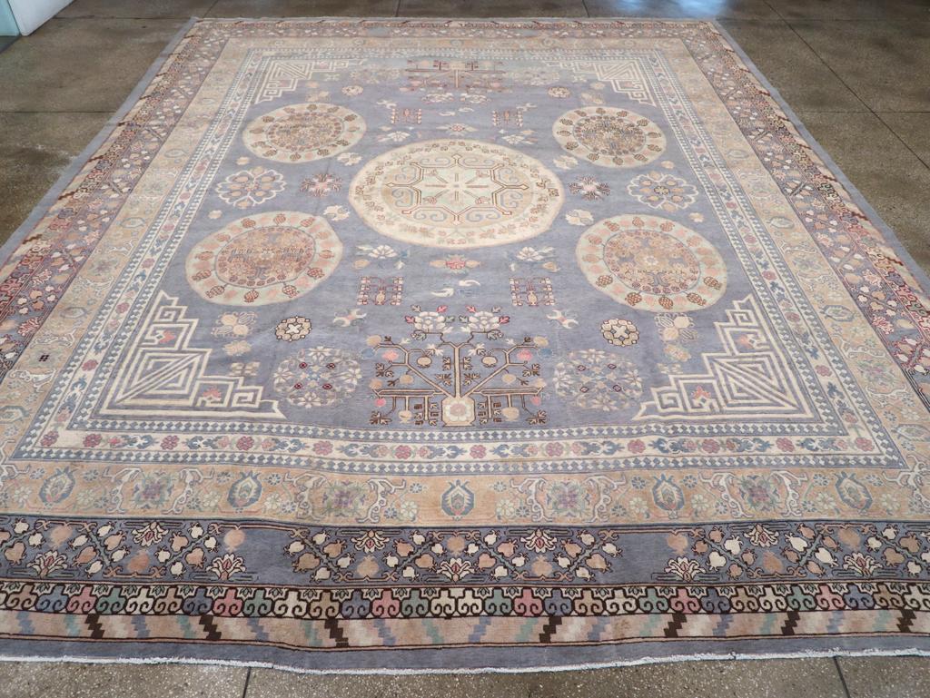 A modern East Turkesan Khotan large room size carpet handmade during the 21st century.

Measures: 12' 9