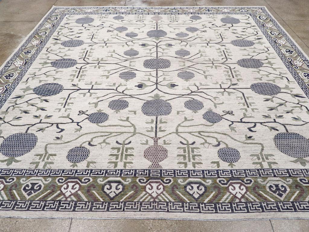 A modern East Turkesan Khotan large square room size carpet handmade during the 21st century.

Measures: 13' 8