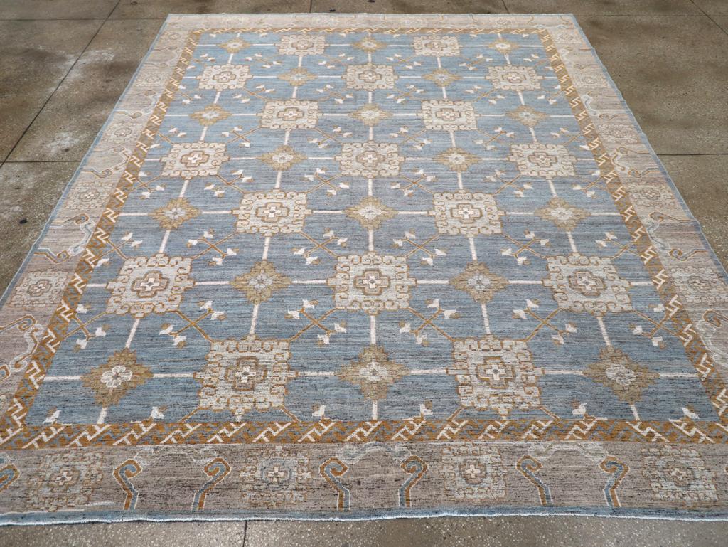 A modern East Turkestan Khotan room size carpet handmade during the 21st century.

Measures: 9' 6