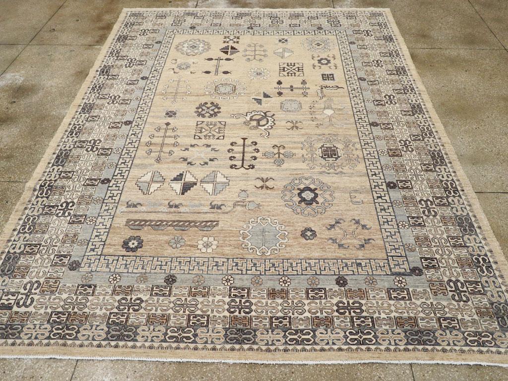 This 21st-century East Turkestan Khotan rug, measuring 8' 11