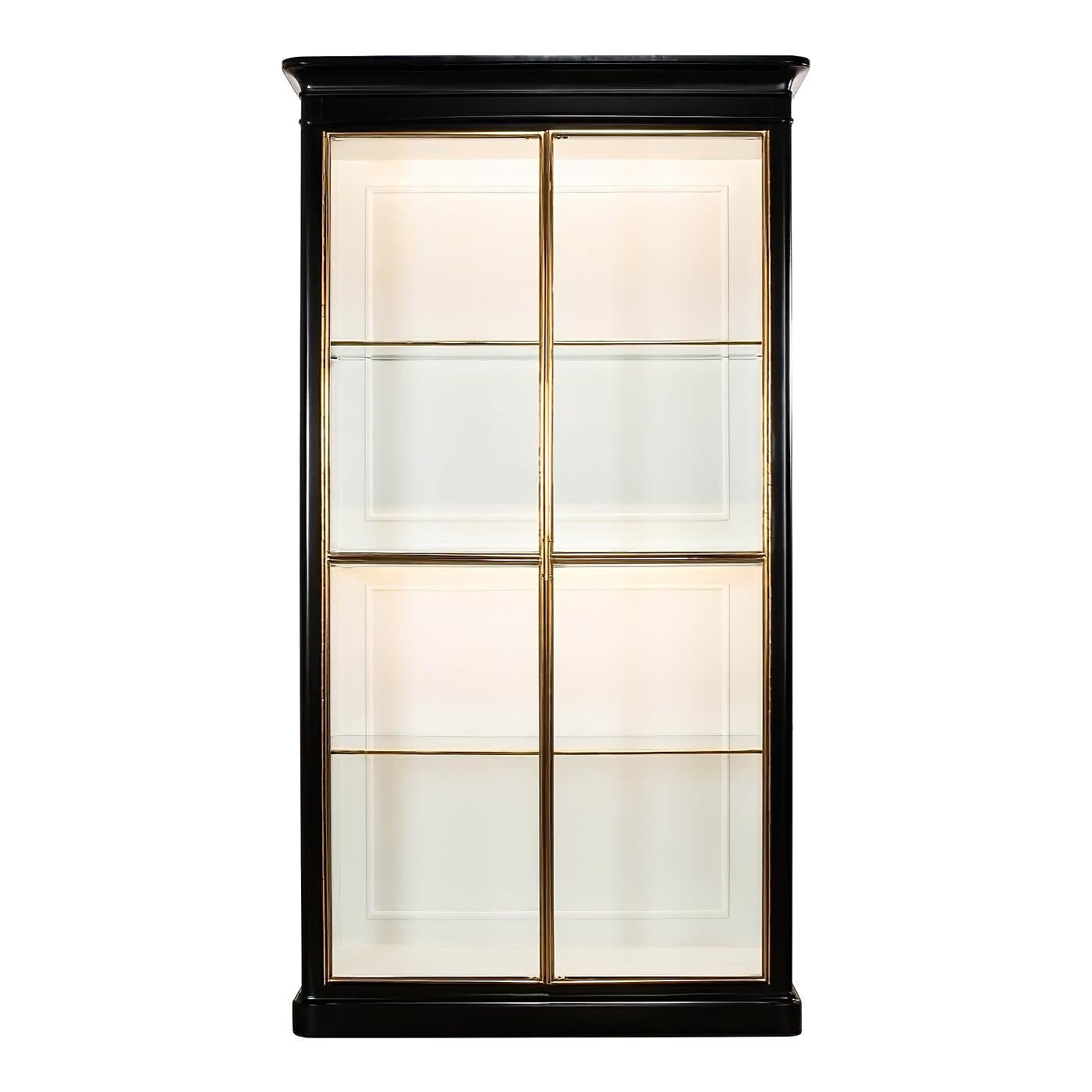 Modern ebonized glass door bookcase with brass trim. An elegant and sophisticated piece in a larger size perfect for display.

This etagere has two glass framed doors that open making it easy to protect and showcase treasured items. This etagere