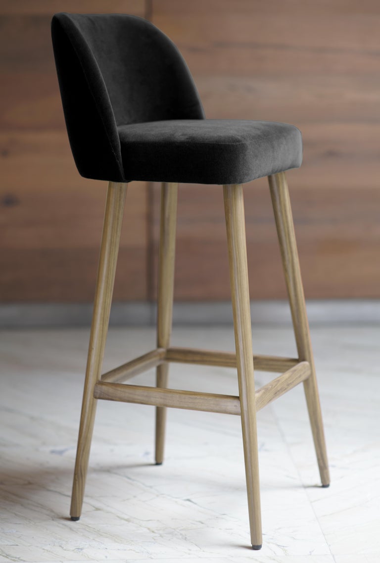 Helsinki collection. Helsinki bar stool: simple, elegant, comfortable. Available in oak and walnut base or in custom materials, may be upholstered with variety of fabrics and colors. Also available as a chair and arm chair. 

Our clients´ favorite
