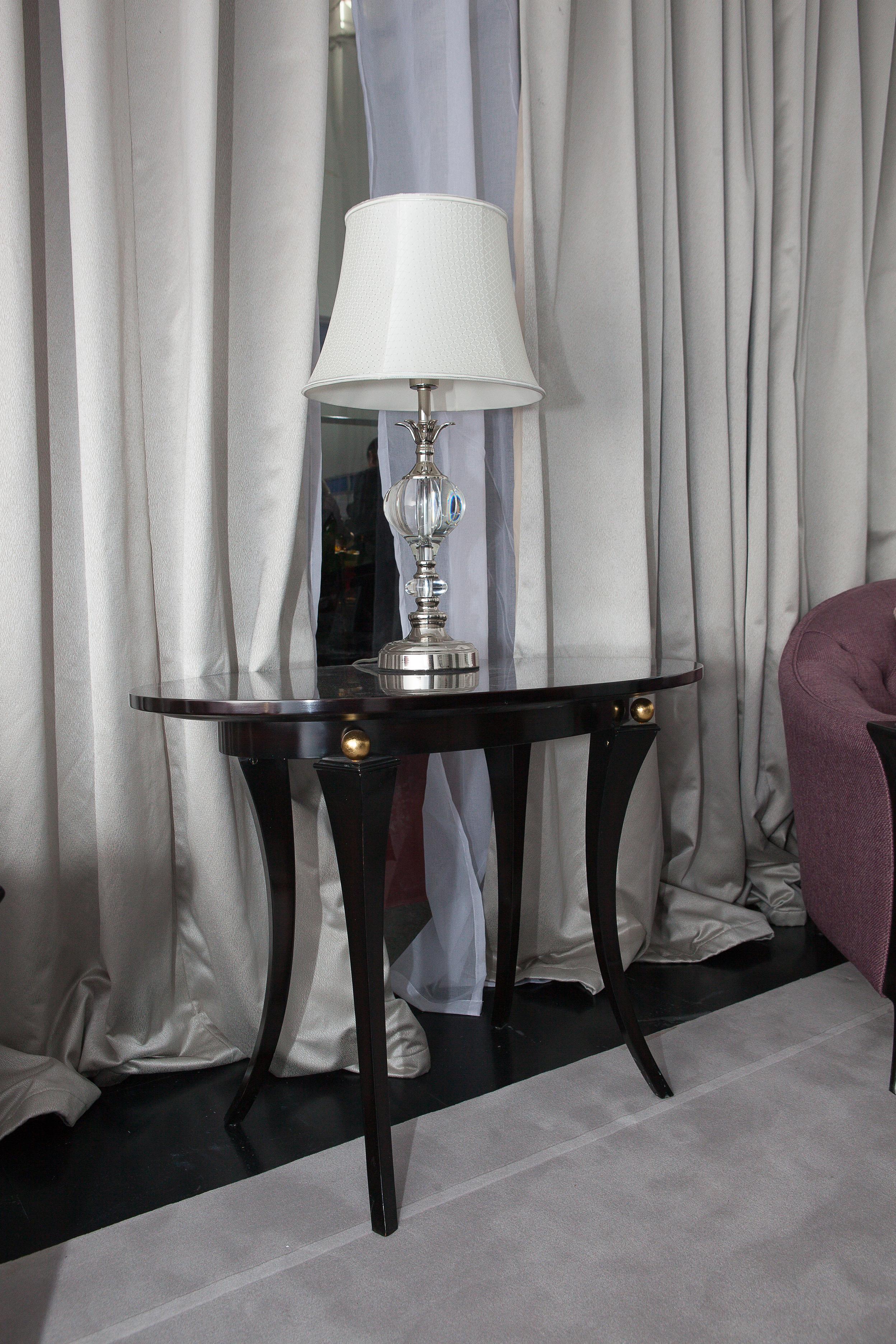Modern Ebony Wood Oval Coffee Table with 4 decorative 24K gold leaf balls to be used as a sside table.