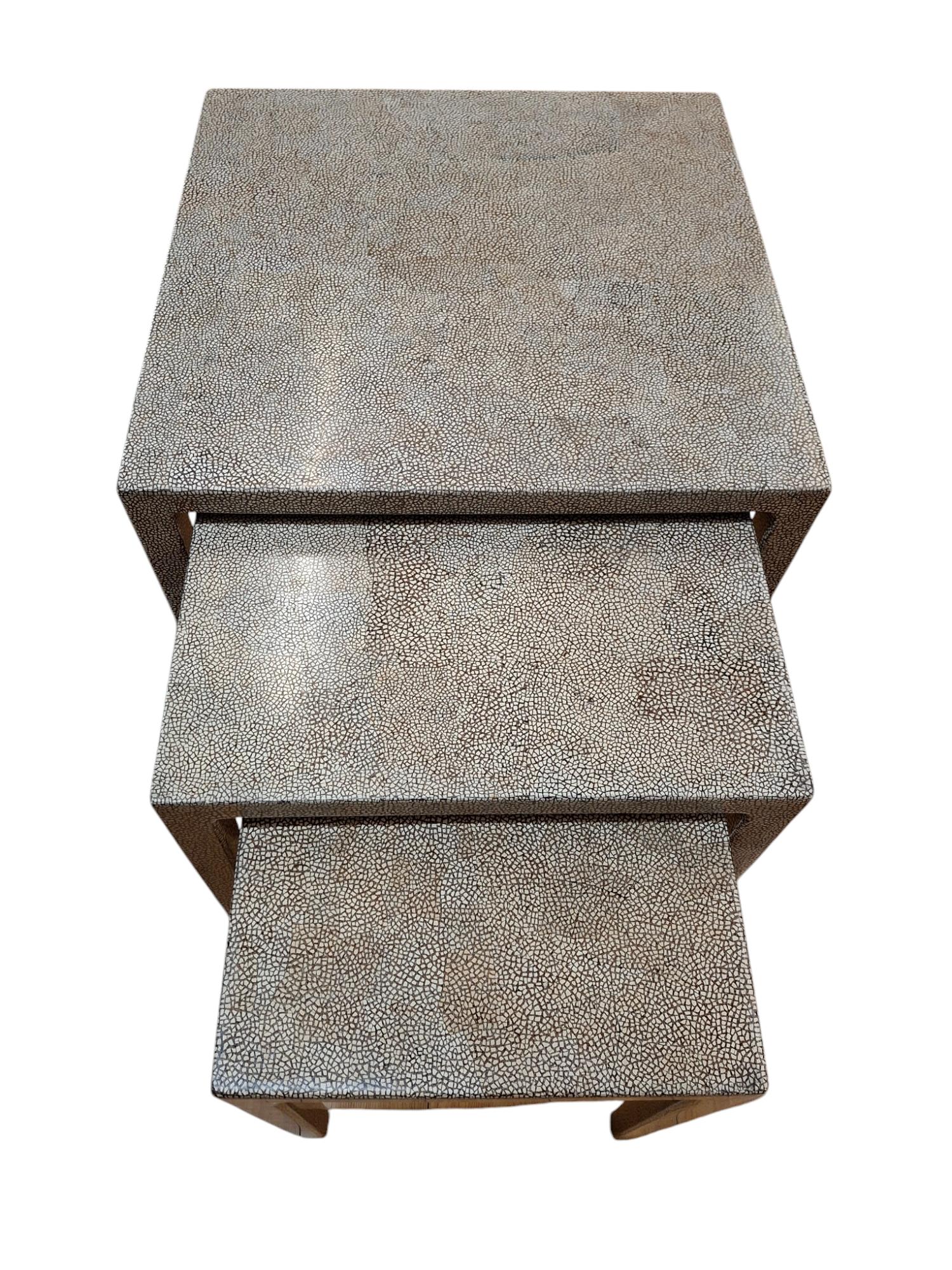 Beautiful set of 3 eggshell lacquer nesting tables in the style of Christian Duc

Small: 15