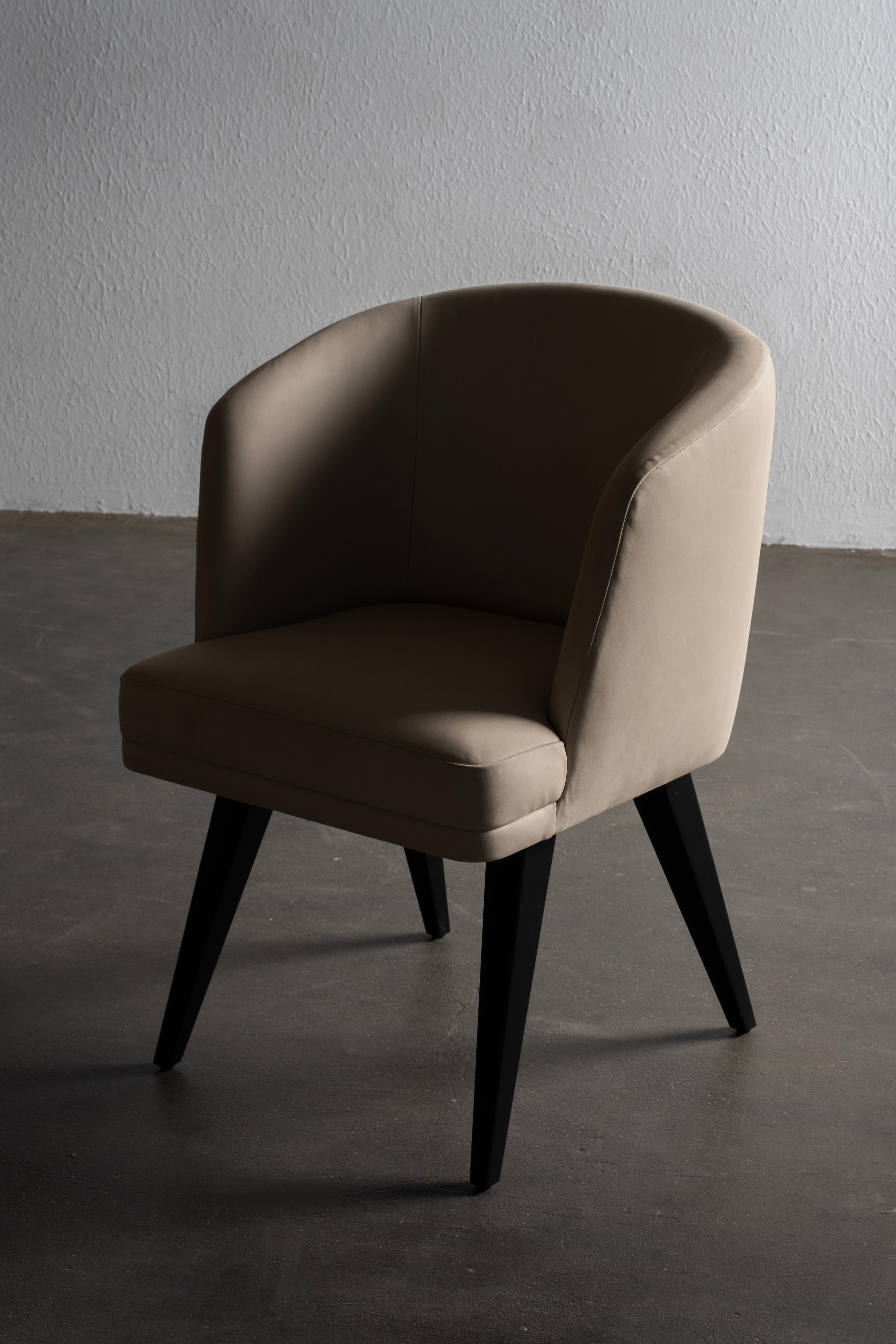 Eleanor Chair, Contemporary Collection, Handcrafted in Portugal - Europe by Greenapple.

The Eleanor leather dining chair, named after Queen Eleanor of Avis, embodies all the virtues of its inspiration. Upholstered in sumptuous fabrics, this dining