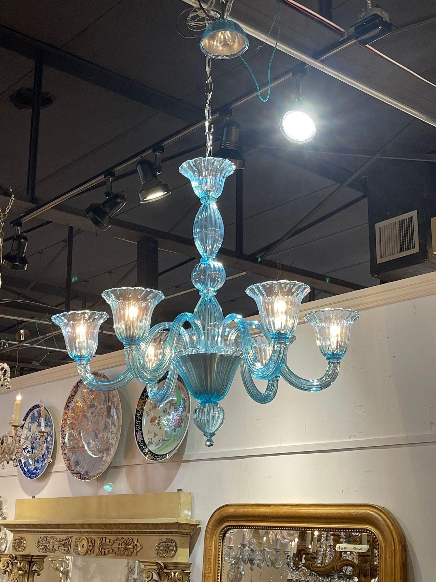 Gorgeous modern electric blue Murano glass chandelier. Featuring beautiful blown glass and such a pretty shade of blue. Amazing!