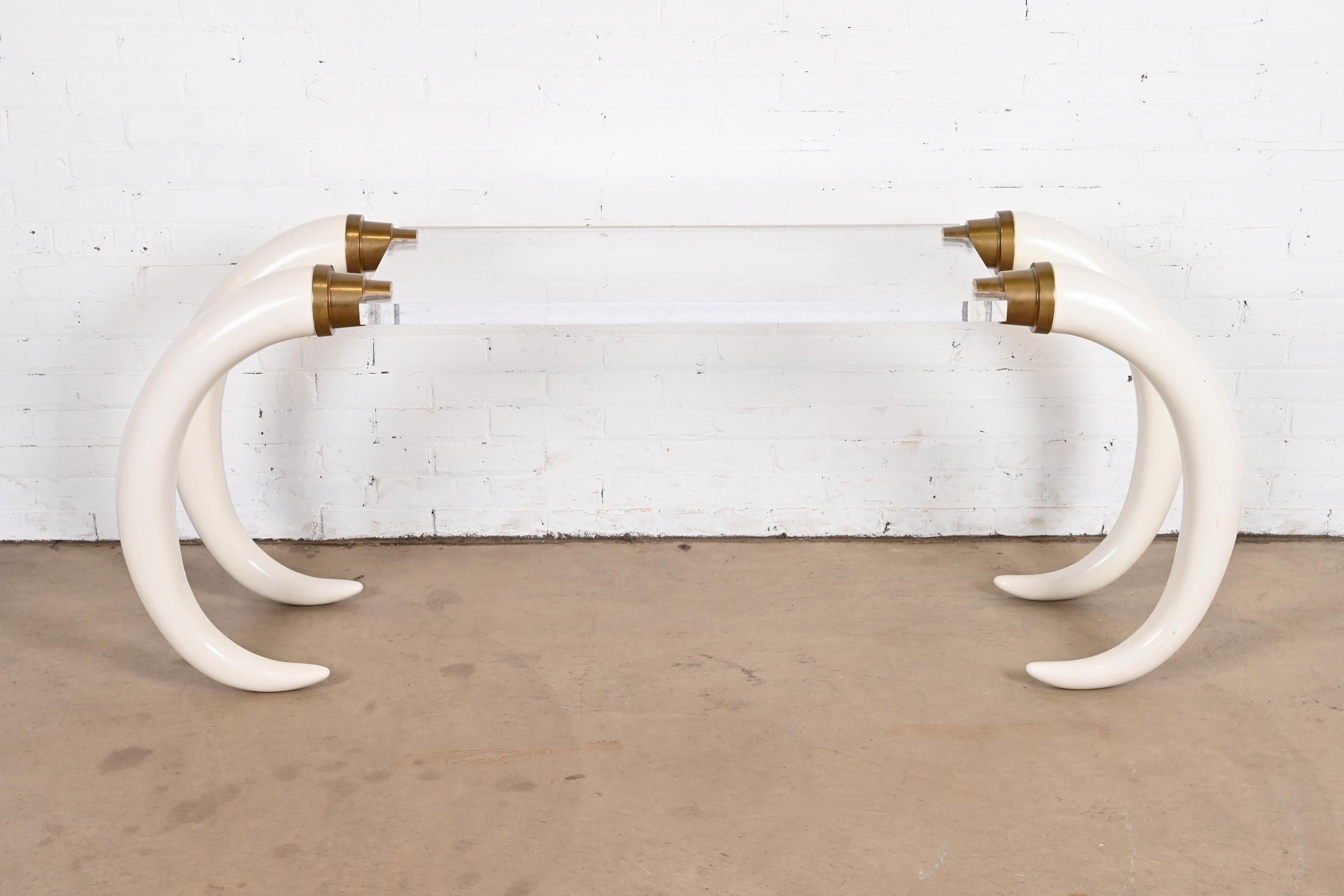 An exceptional Modern Hollywood Regency elephant tusk console table, sofa table, or writing desk

By Suzzane Dahl & Jerry Barich for the Versailles Collection

USA, 1970s

Gorgeous cast resin elephant tusks, with thick lucite table top and cast