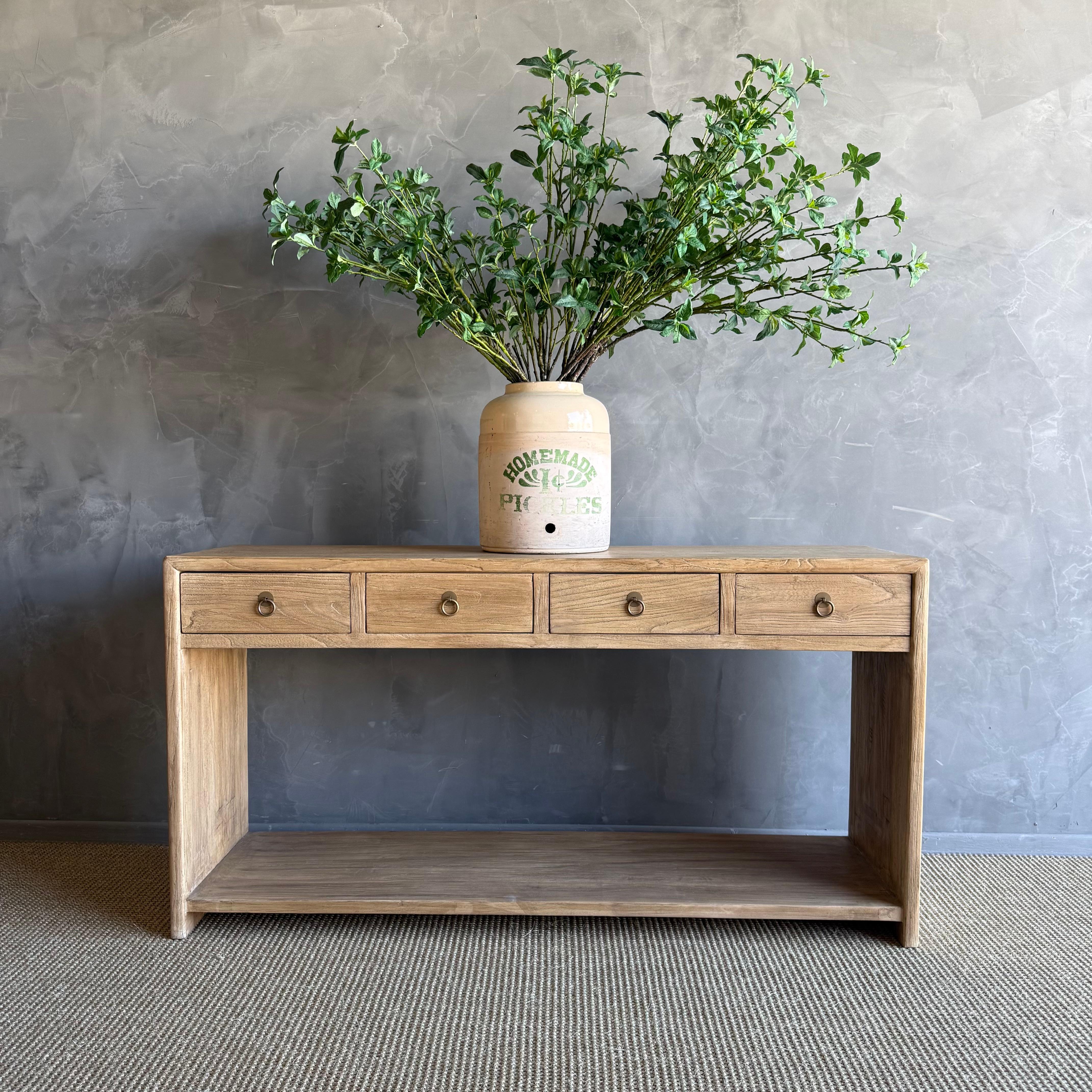 IVAN NATURAL CONSOLE TABLE
Natural reclaimed elm wood that is beautifully crafted and serves as the perfect storage solution for any space. Since this is made from vintage reclaimed materials, there may be some imperfections in the piece or grain of