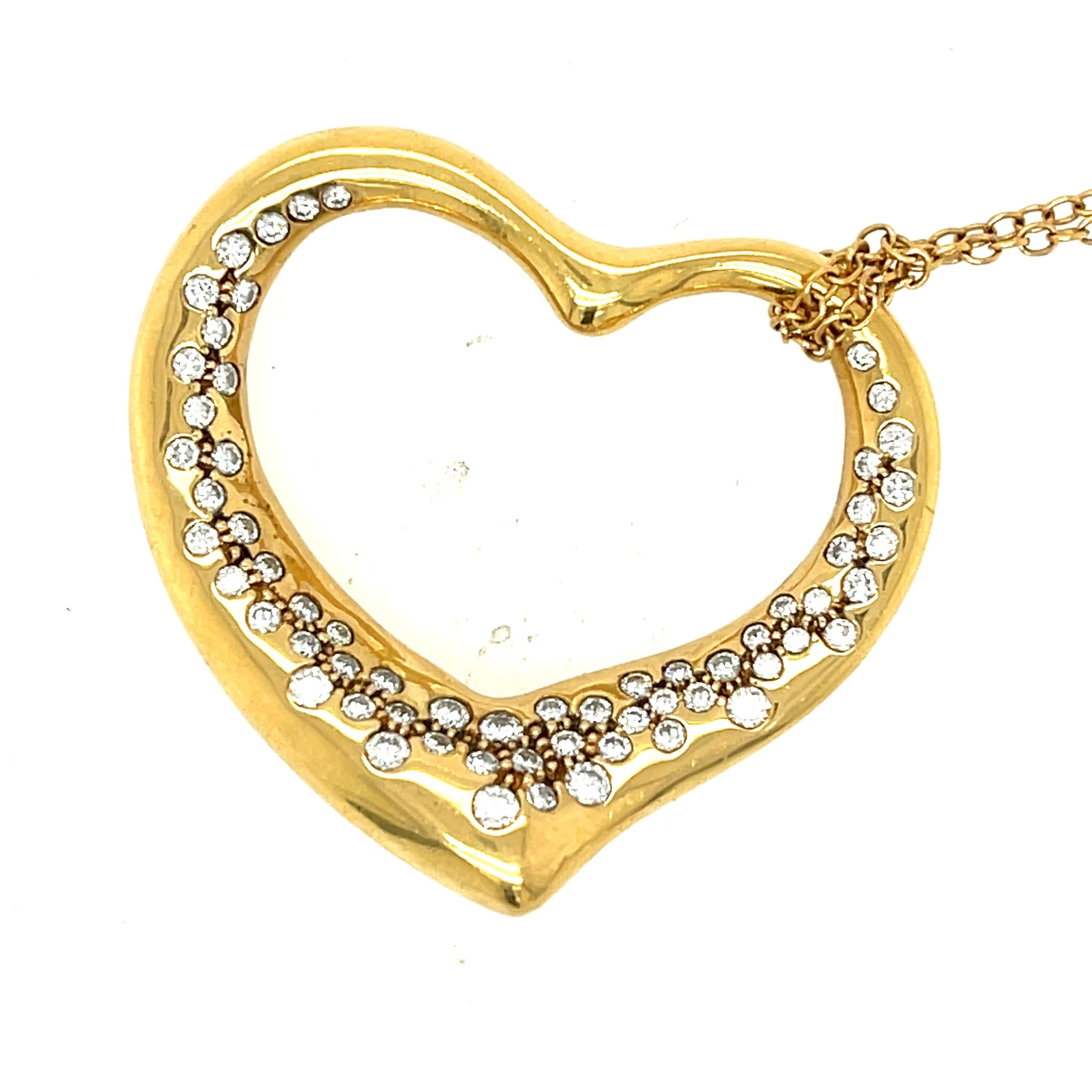 Modern large size open heart diamond pendant necklace by Tiffany & Co. designed by Elsa Peretti circa 1980. Both items are 18k yellow gold and the chain is sign Peretti as well as the heart which is signed Tiffany & Co. 18k Peretti. The long chain