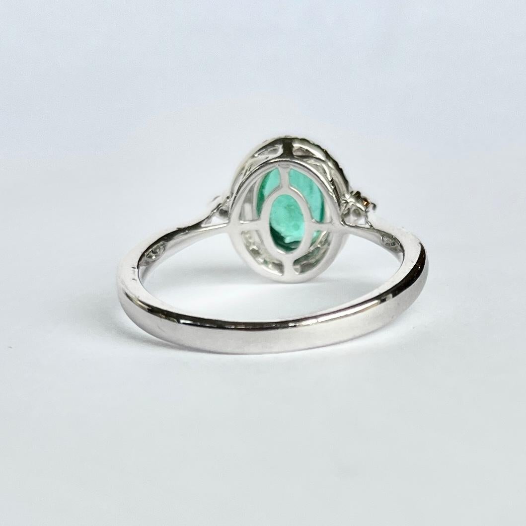 Women's Modern Emerald and Diamond Platinum Cluster Ring For Sale