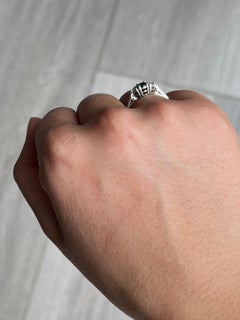 Modern Emerald and Diamond Platinum Three-Stone Ring