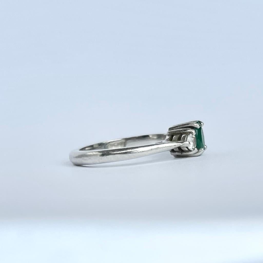 Women's Modern Emerald and Diamond Platinum Three-Stone Ring For Sale