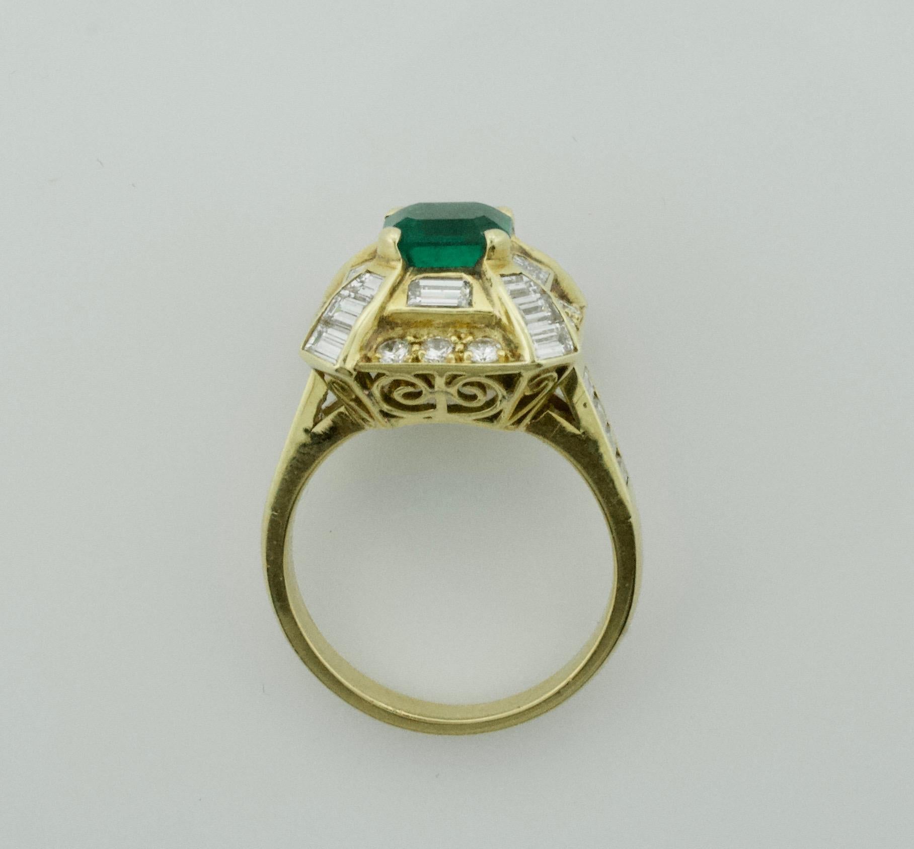 Modern Emerald and Diamond Ring by Terrell and Zimmelman in 18k
One Emerald Cut Emerald  weighing 1.19 carats
Twenty Four Baguette  Cut Diamonds weighing 1.57 carats
Twelve Round Brilliant Cut Diamonds weighing .31 carats approximately
Total 1.88 in