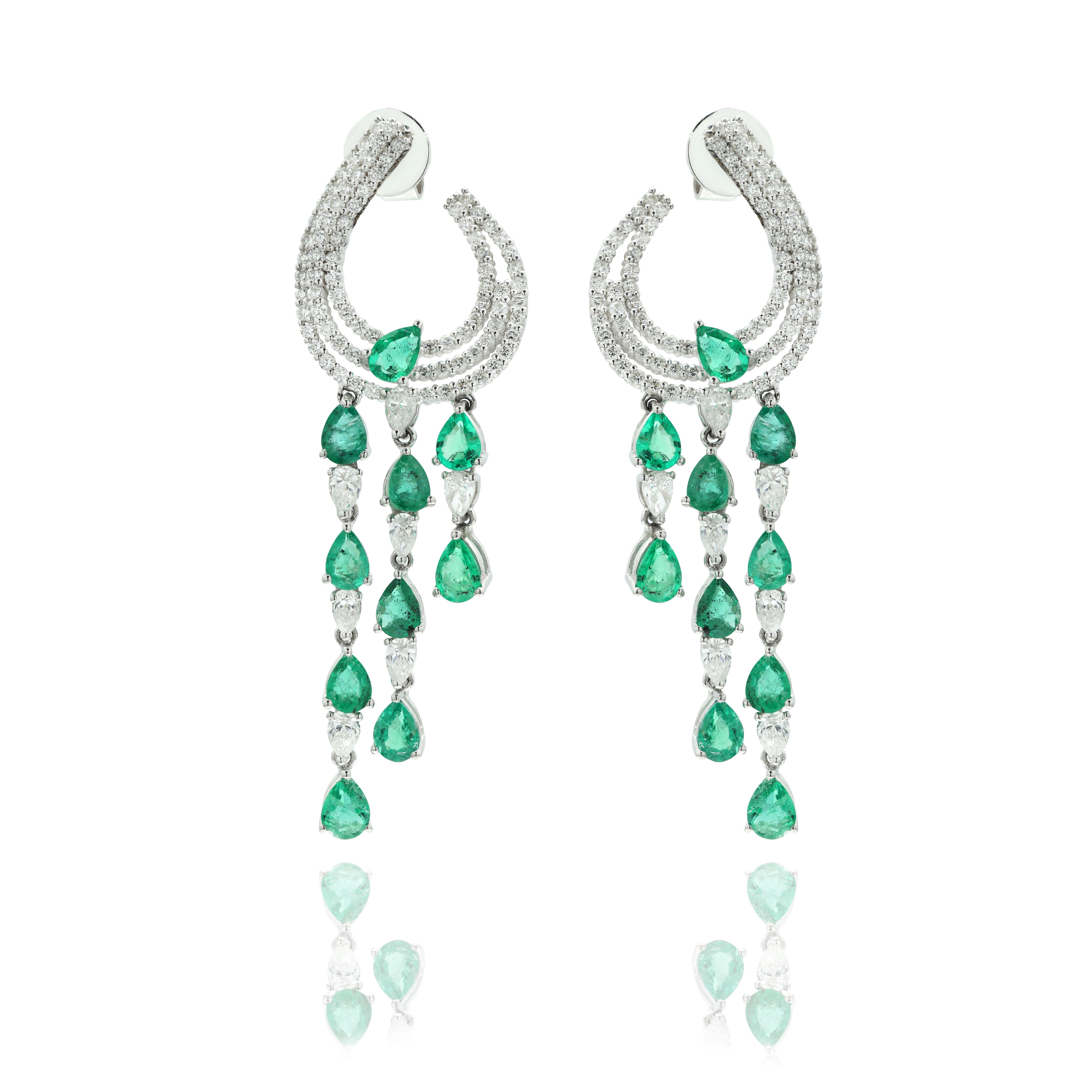 Emerald and Diamond Dangle Earrings to make a statement with your look. These earrings create a sparkling, luxurious look featuring pear cut gemstone.
If you love to gravitate towards unique styles, this piece of jewelry is perfect for you.

PRODUCT