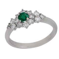 Bague moderne en platine, émeraude et diamant