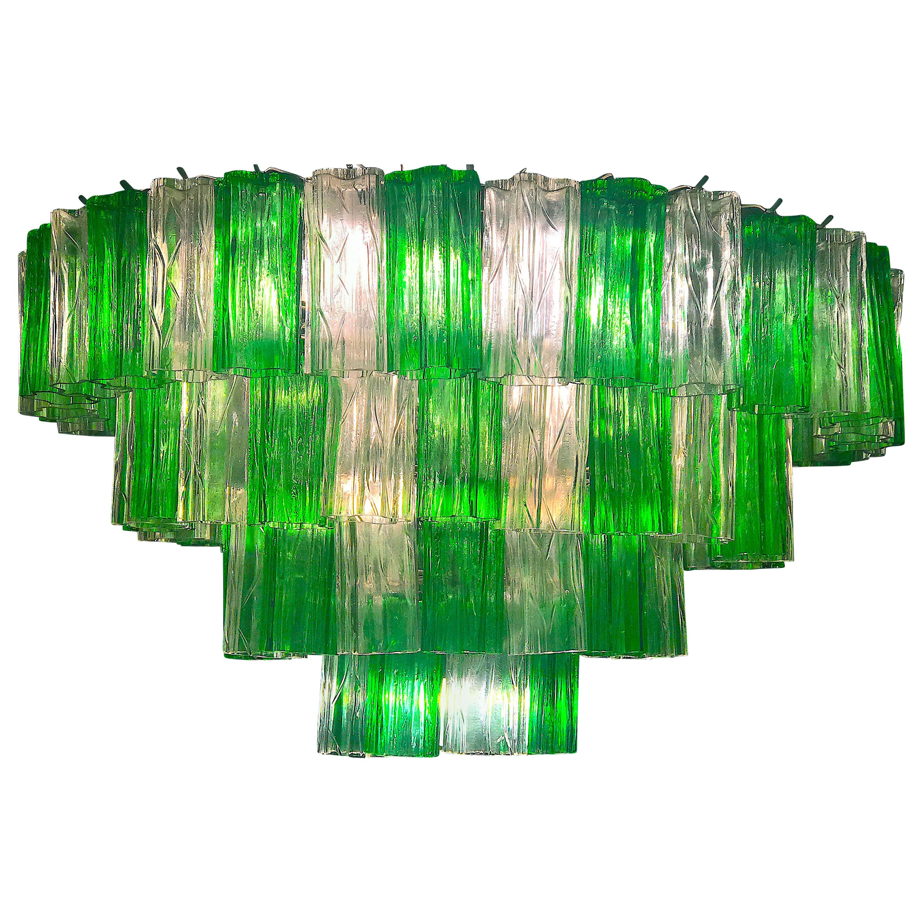 This outstanding chandelier with rare color combination considering the uniqueness with Emerald and ice color precious Murano glasses. Each chandelier with 80 Original glass blown elements supported by a chrome frame.
12 E 14 light bulbs. Excellent