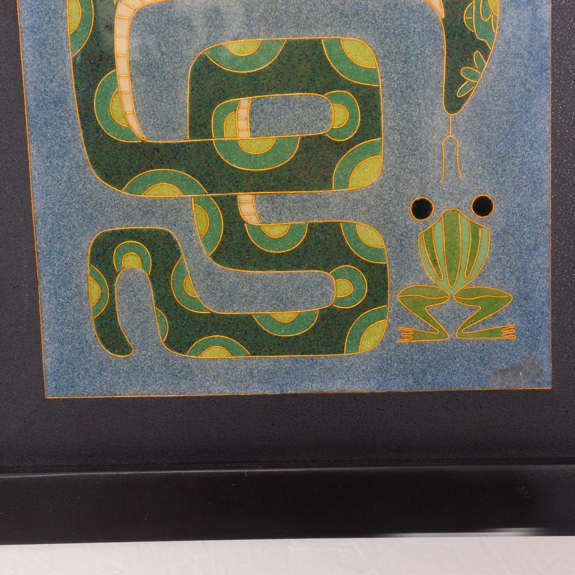 1980s modern enamel wall art work whimsical frog and snake in a soothing blue and green color modern design.  Framed Art. 
Measures: Height 10.5 in. (26.67 cm), width 10.5 in. (26.67 cm), depth 1 in. (2.54 cm)
Wear consistent with age and use. Minor