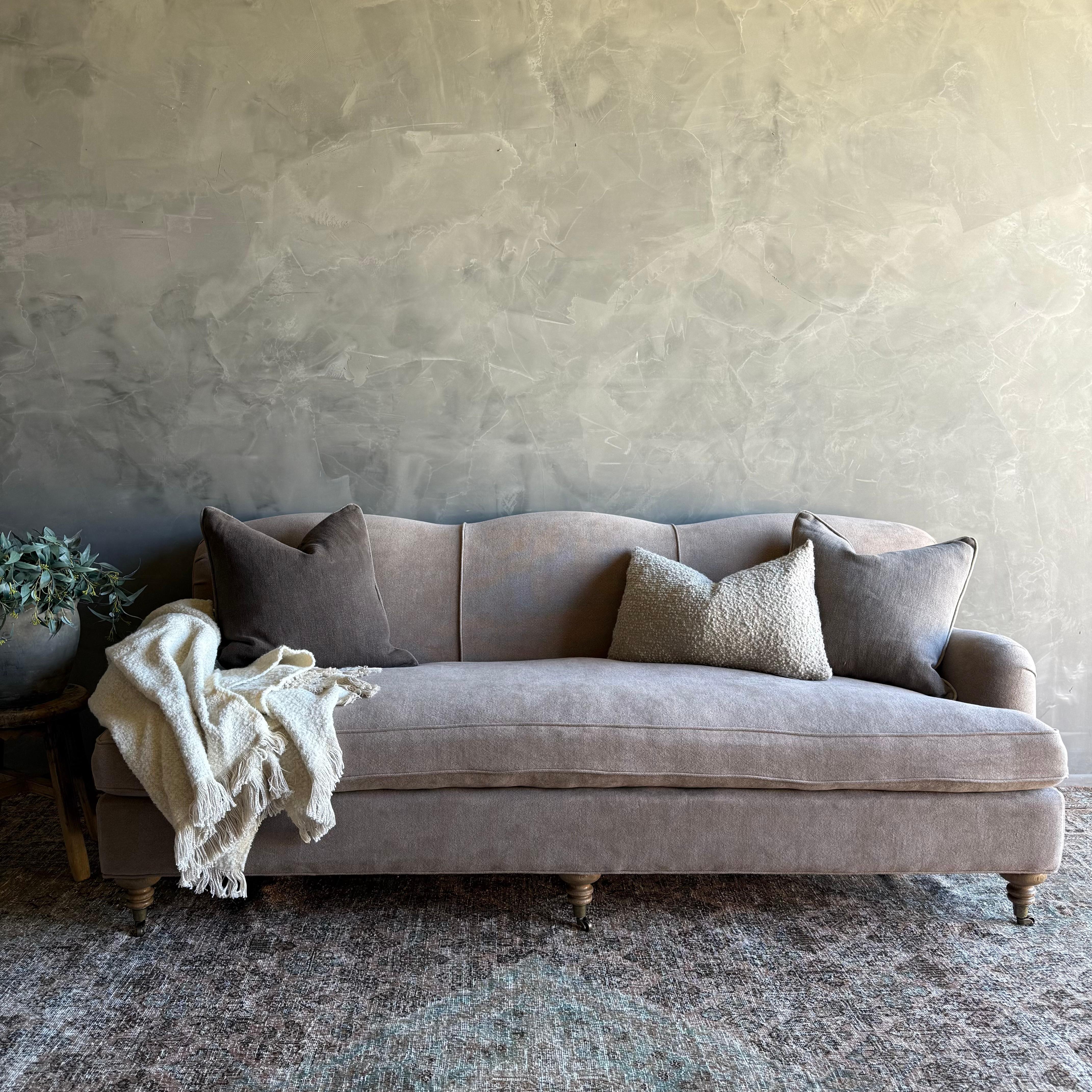 Modern English Arm Sofa Introducing the English Arm Sofa, crafted with heavy weight hemp boasting a soft hand feel for added luxury.

This sofa features a down feather wrapped seat cushion for ultimate comfort and relaxation. Supported by solid oak