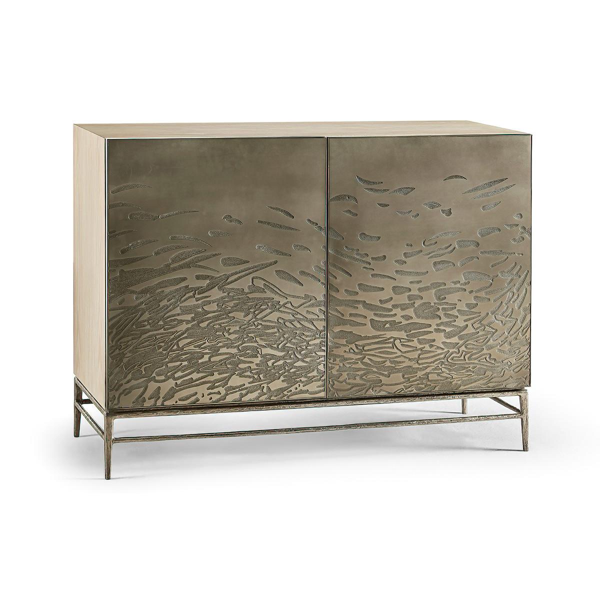 Modern etched brass flowing cabinet pairs bleached oak and metal and creates a stunning cabinet. The modern cabinet with age-old acid etched techniques on steel doors with an abstract flowing water motif in relief. Sitting atop delicate natural