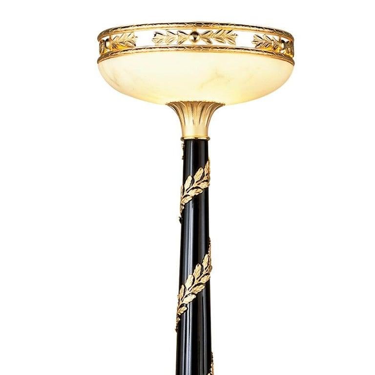 Bring the nostalgic Grand Tour style and Bridgerton Design into your home with this floor lamp torchere of Empire revival design. This contemporary work is entirely hand-made in Spain, with high-quality materials, the black lacquered wood structure