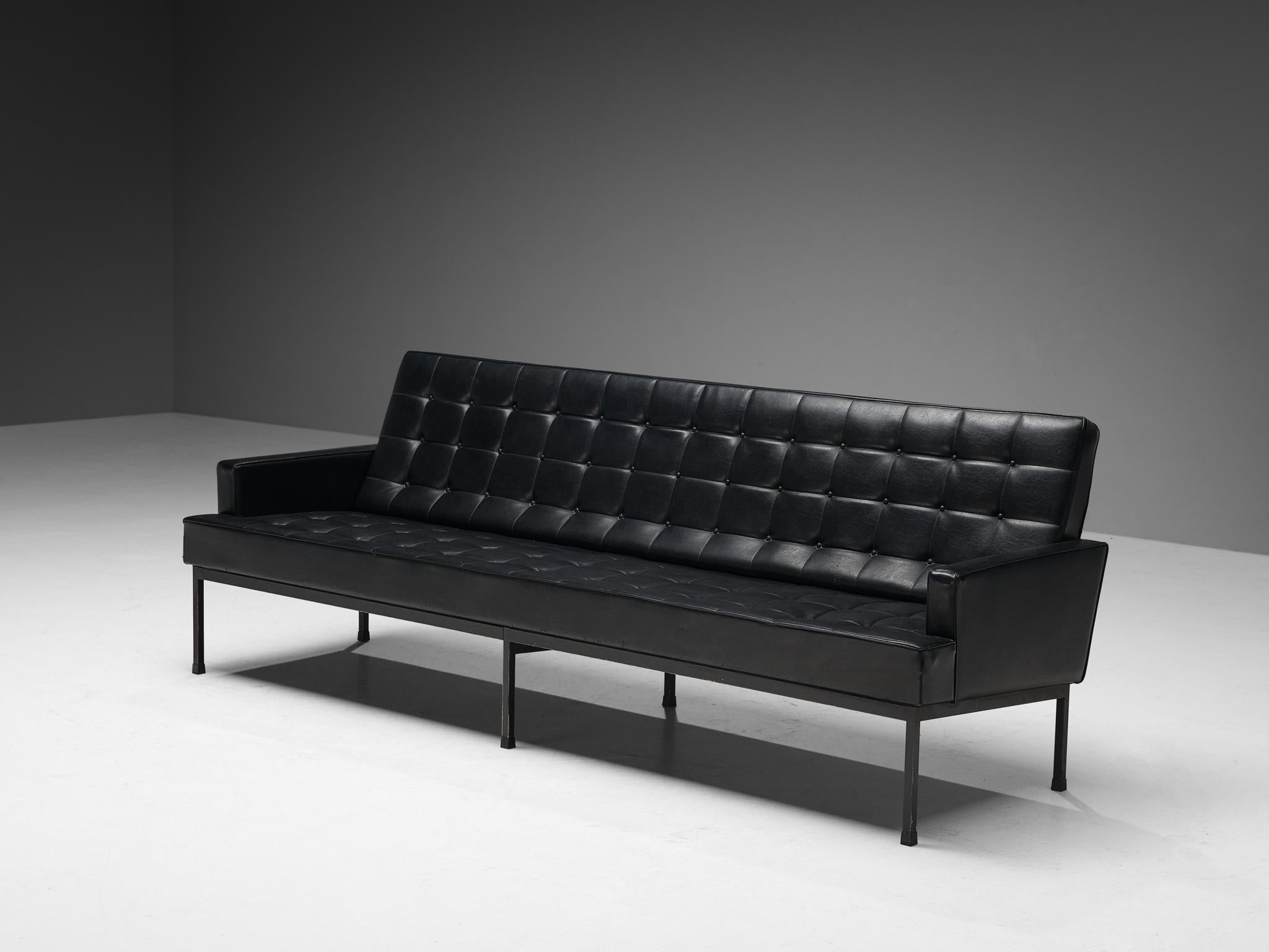 Sofa, leatherette, lacquered metal, Northern Europe, 1970s

The design is characterized by a solid construction based on sharp lines and geometrical shapes that are noticeable in the body of the seat and the black lacquered metal base, underlining