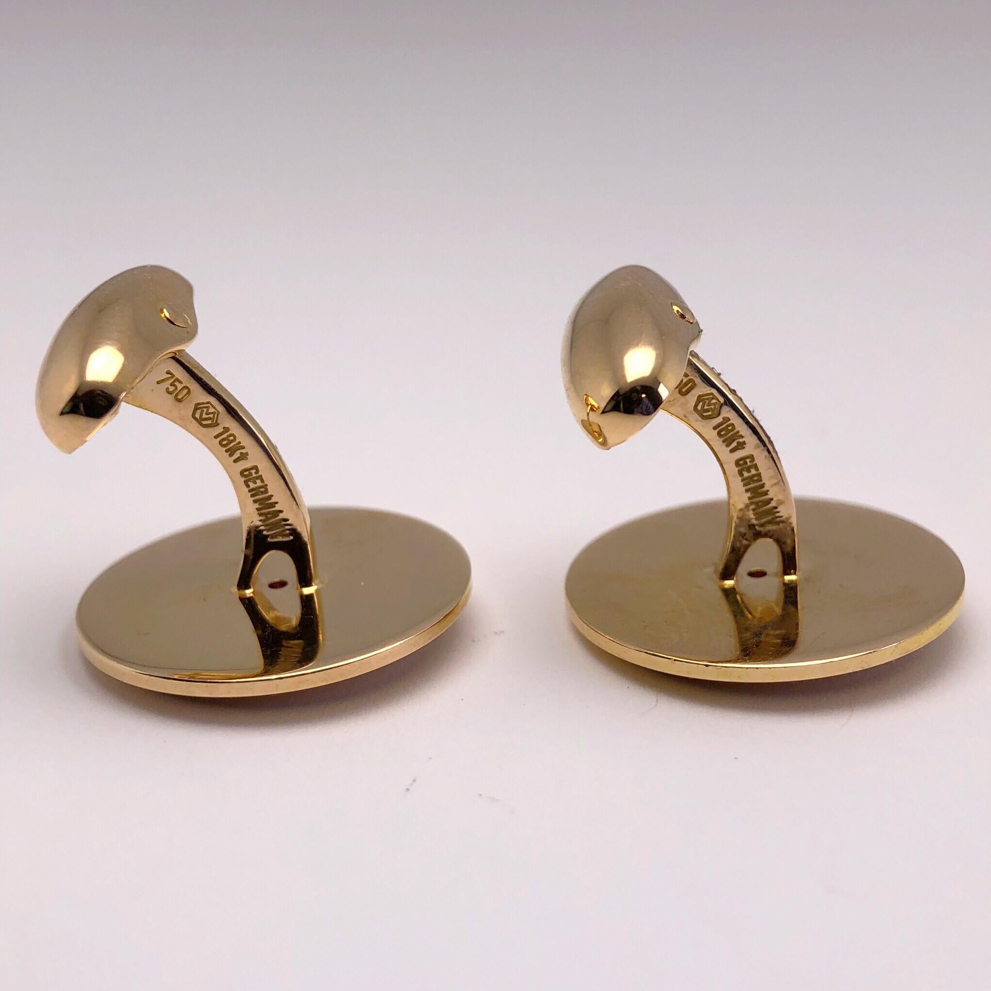 These classic Faberge 18 karat rose gold cuff links have been hand polished with a satin and shiny swirl finish. Each cuff link has a round brilliant diamond center in a bezel setting. 
Total diamond weight 0.14cts. Limited edition #44/500
The