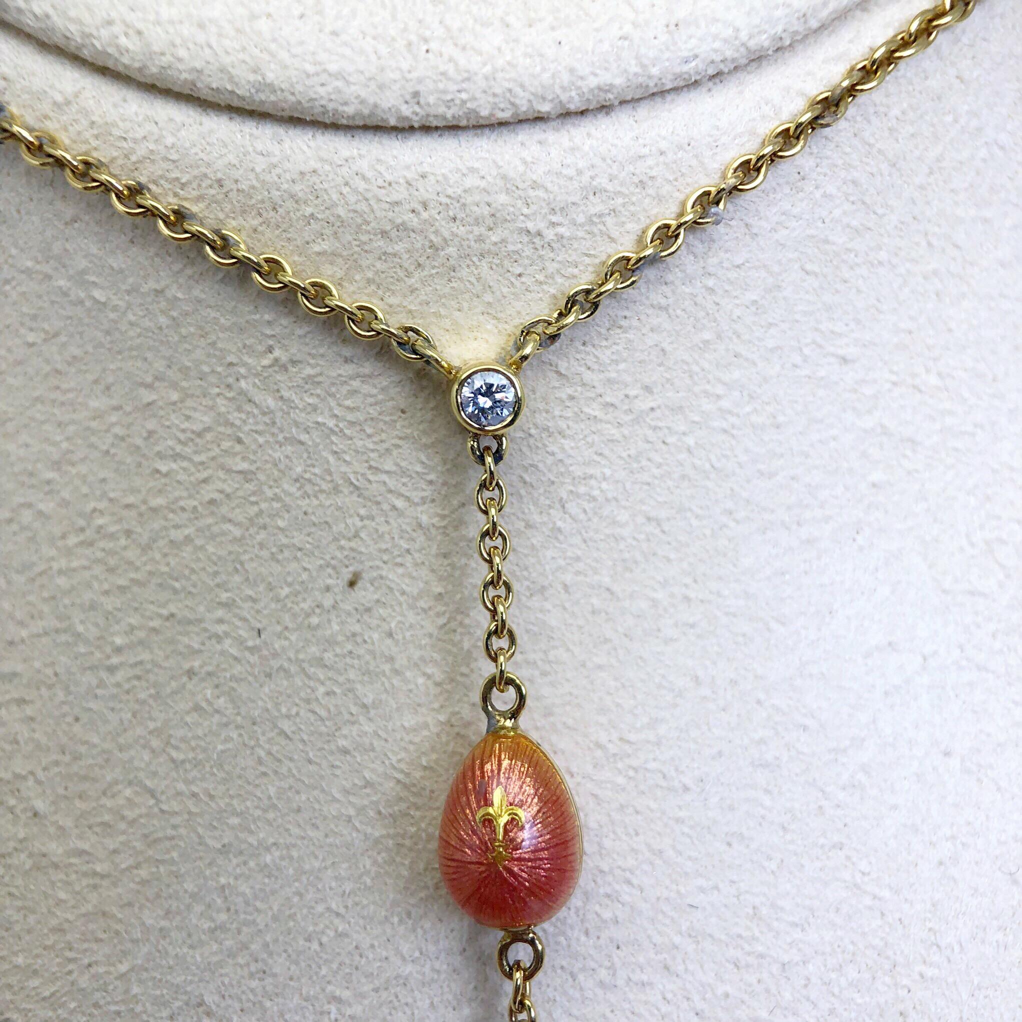 Feel like royalty in this elegant Faberge necklace. Created using the same techniques as the original Faberge, the enamel eggs are created with 7 layers of enamel that have been Guillochéd. Each of these 3 eggs have a different motif. The peach