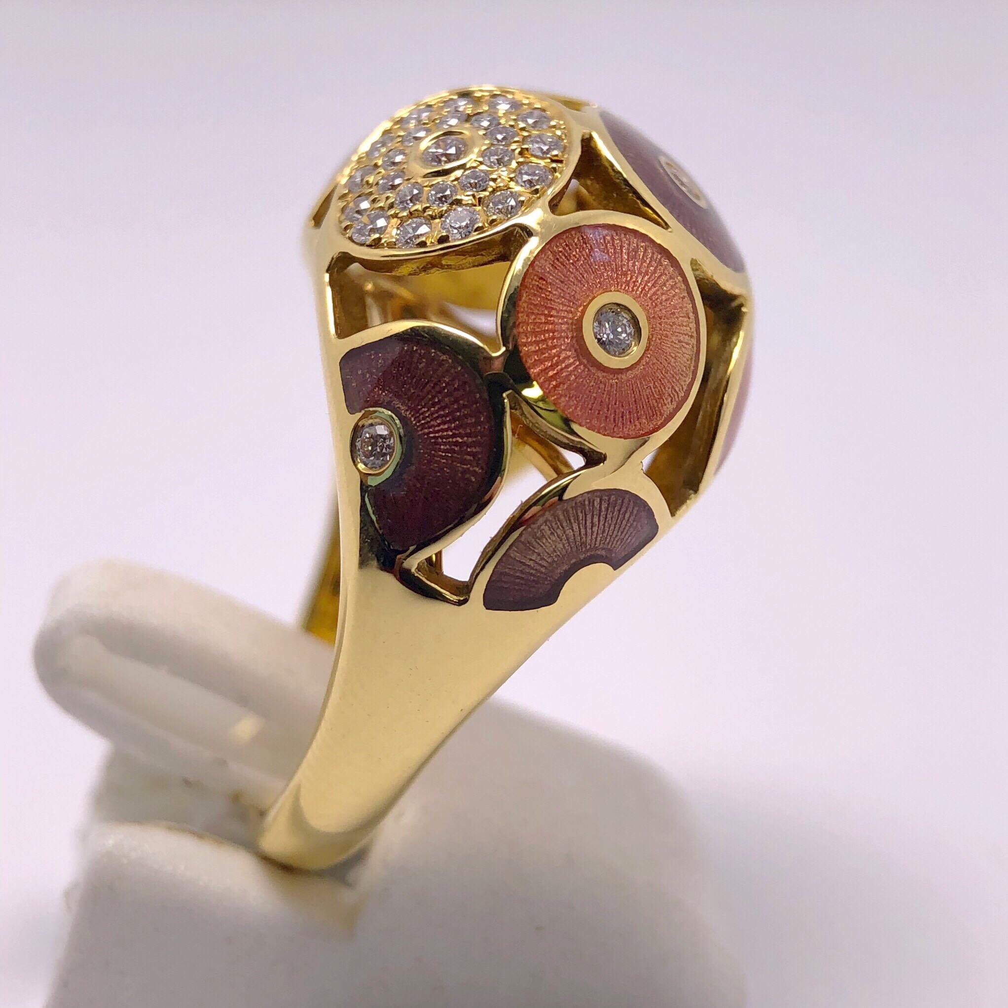This Modern 18 karat yellow gold Faberge dome ring by Victor Mayer, features an array of circles, some of which are completely diamonds while others are composed of purple and orange Guilloché enamel which are  detailed with a single diamond center.