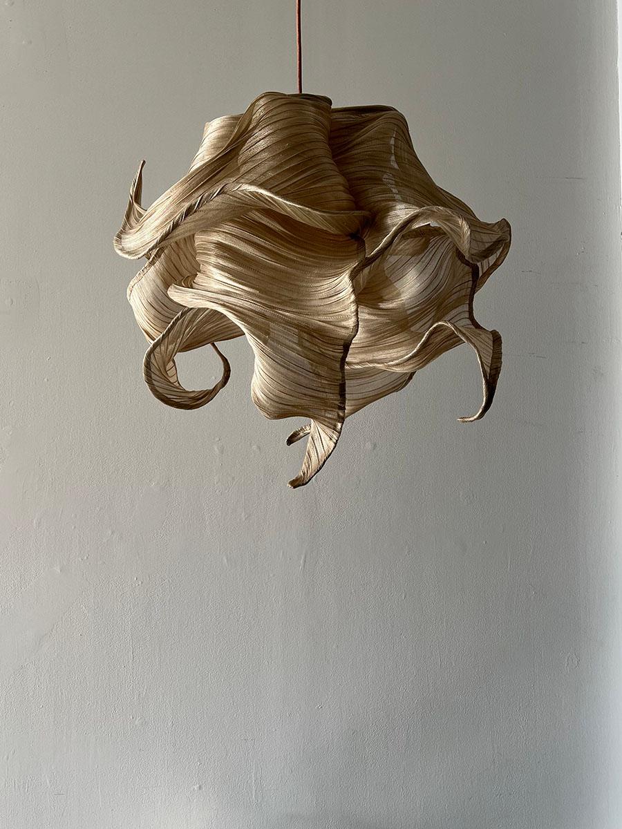 The Nebula collection is drawn out of the interstellar clouds of dust and gas in space - regions where stars begin to form. Made of a woven natural fiber from the banana tree, which is then manipulated and sculpted until it reaches its voluminous